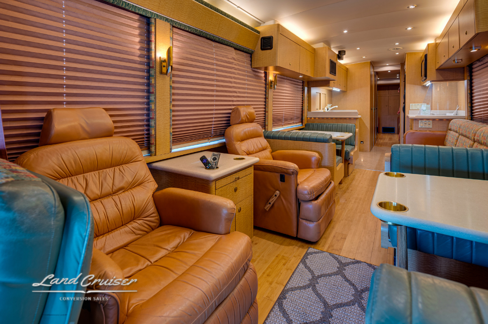 Spacious interior layout of MCI motorhome with multiple seating areas
