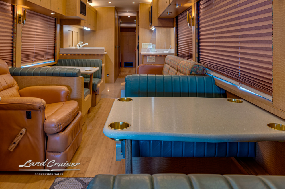 View from galley into rear lounge of MCI motorhome with pocket doors
