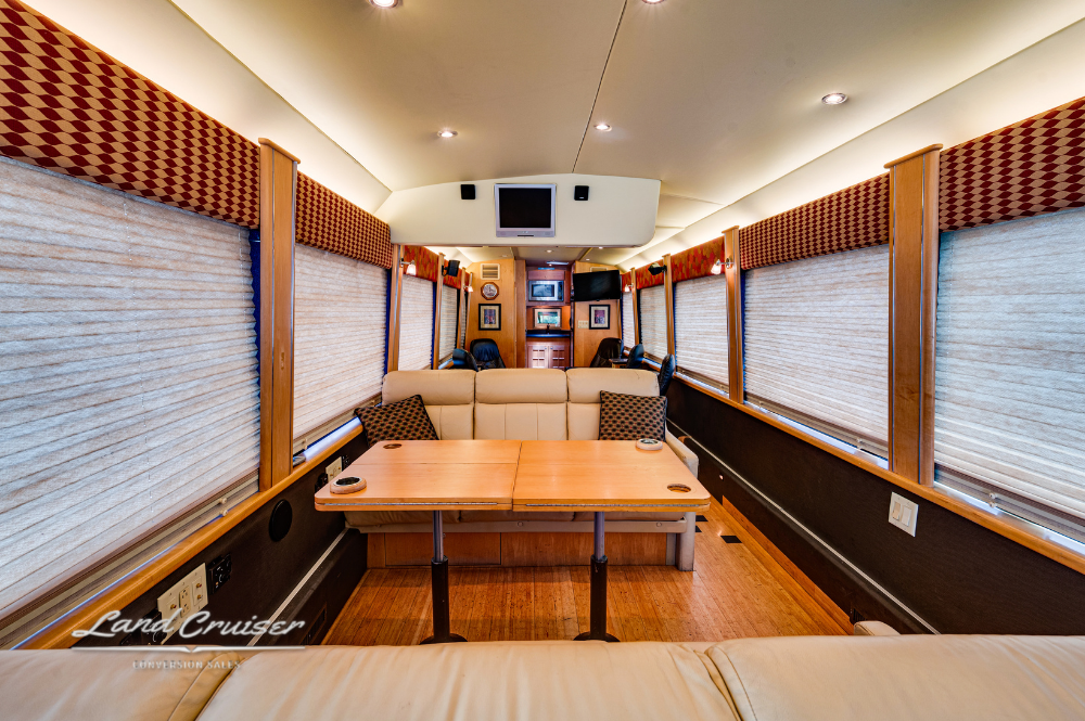 Full-width dining area showcasing window blinds and built-in storage compartments