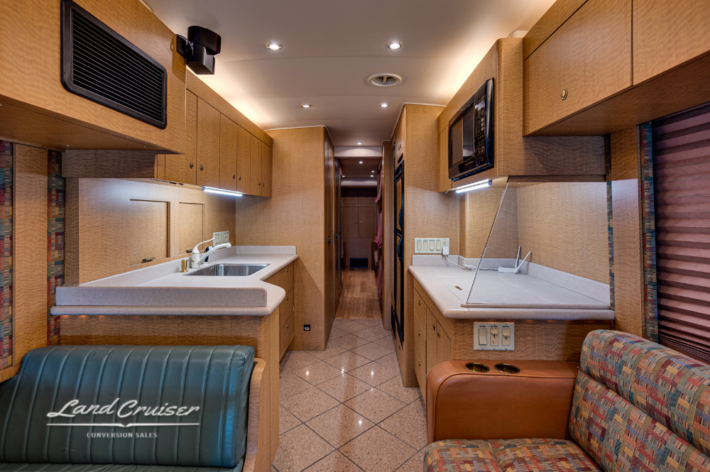 Open view from lounge toward galley in MCI motorhome