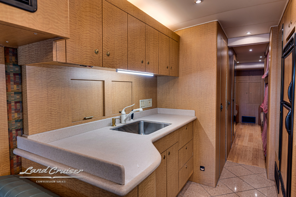 Kitchen sink with solid surface countertop and under-cabinet lighting in MCI 102EL3