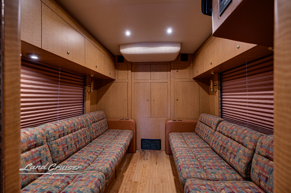 Rear lounge with opposing sofas upholstered in patterned fabric