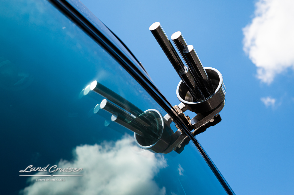 Windshield-mounted wiper arms on MCI 102EL3 coach