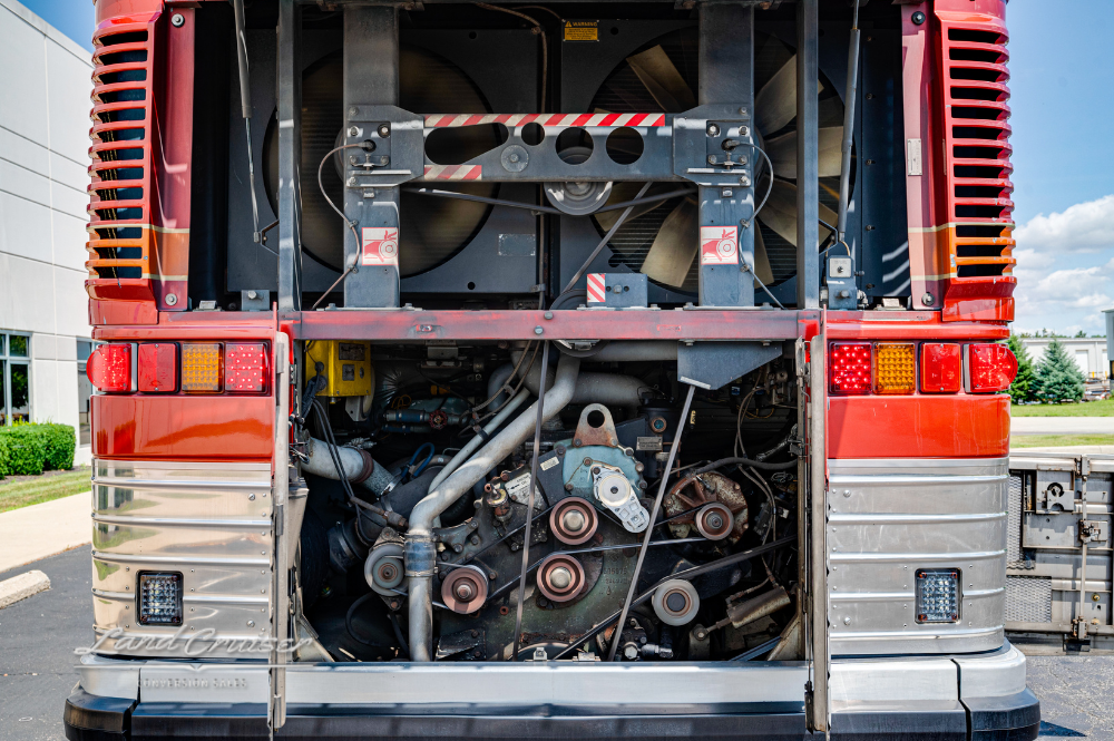 Engine bay of Detroit 60 Series motor exposed at rear of MCI 102DL3 bus