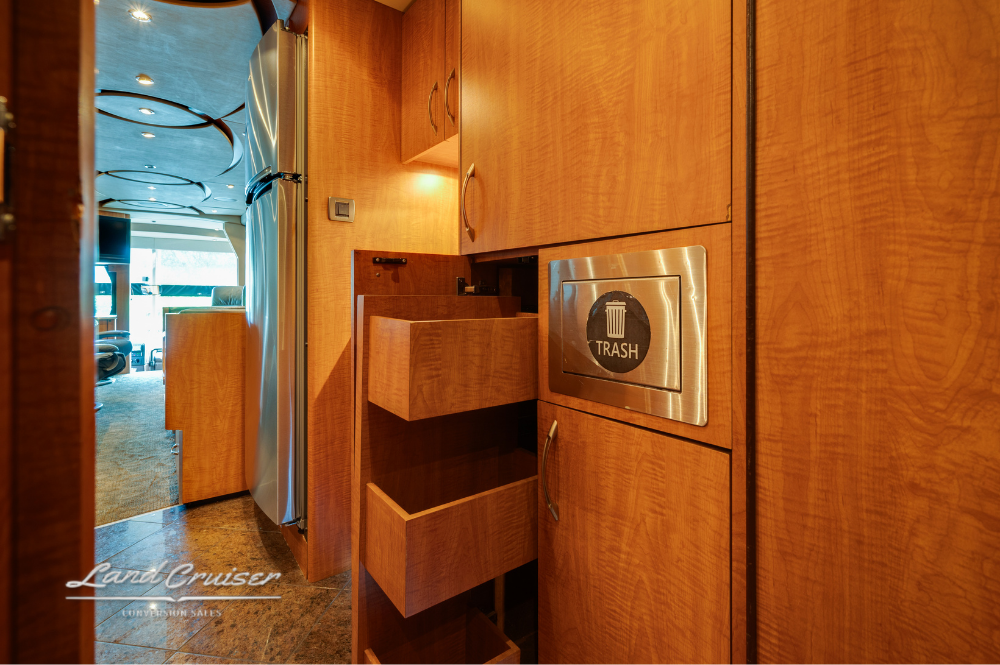 Open pull-out drawers and Splendide washer-dryer combo in hallway closet.