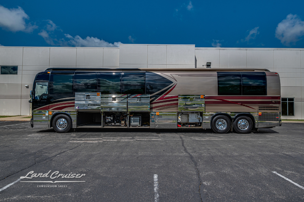 Full-length shot showing all under-bay compartments open on 2002 Prevost XLII motorhome