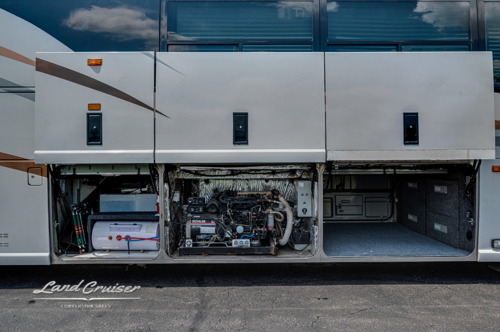 Underbody compartments with electrical systems visible on MCI coach