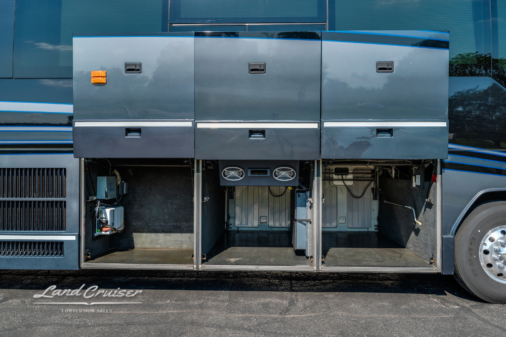 Service and storage bays of the coach displayed in full, illustrating accessible layout for touring needs.