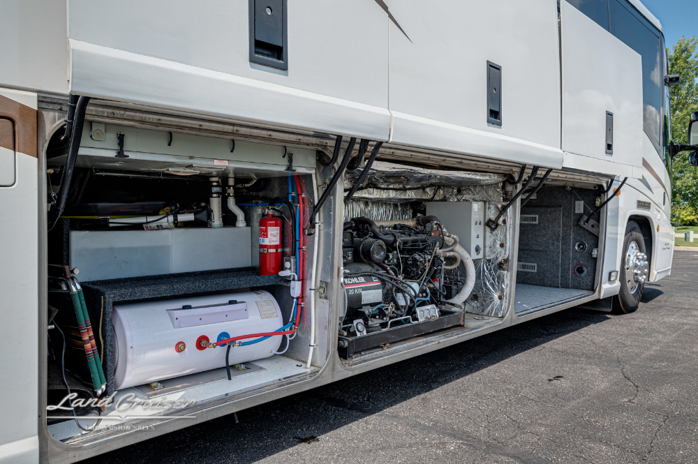 Open bay showing generator and storage compartments on MCI motorhome