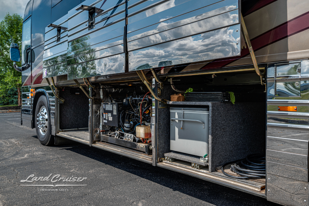 Curbside view of open bay compartments showing inverter and wiring in 2002 Prevost XLII Custom Coach