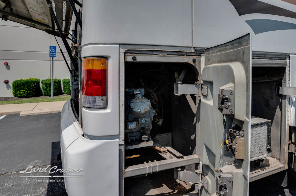 Open rear engine compartment of MCI 102EL3 motorhome showing Detroit Diesel engine