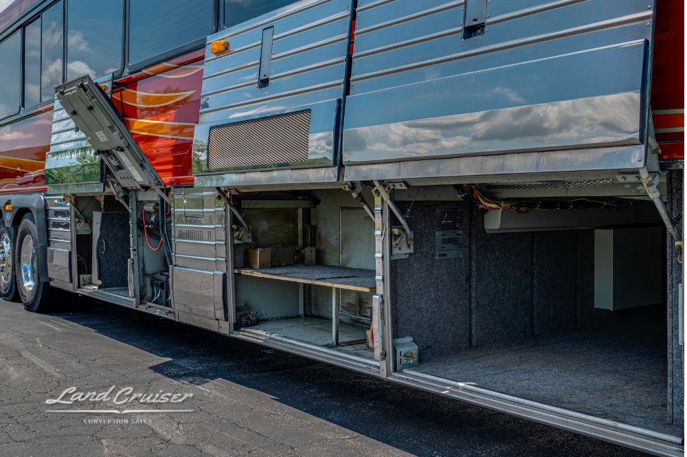 Angle showing open compartments and polished aluminum doors beneath Churchill coach