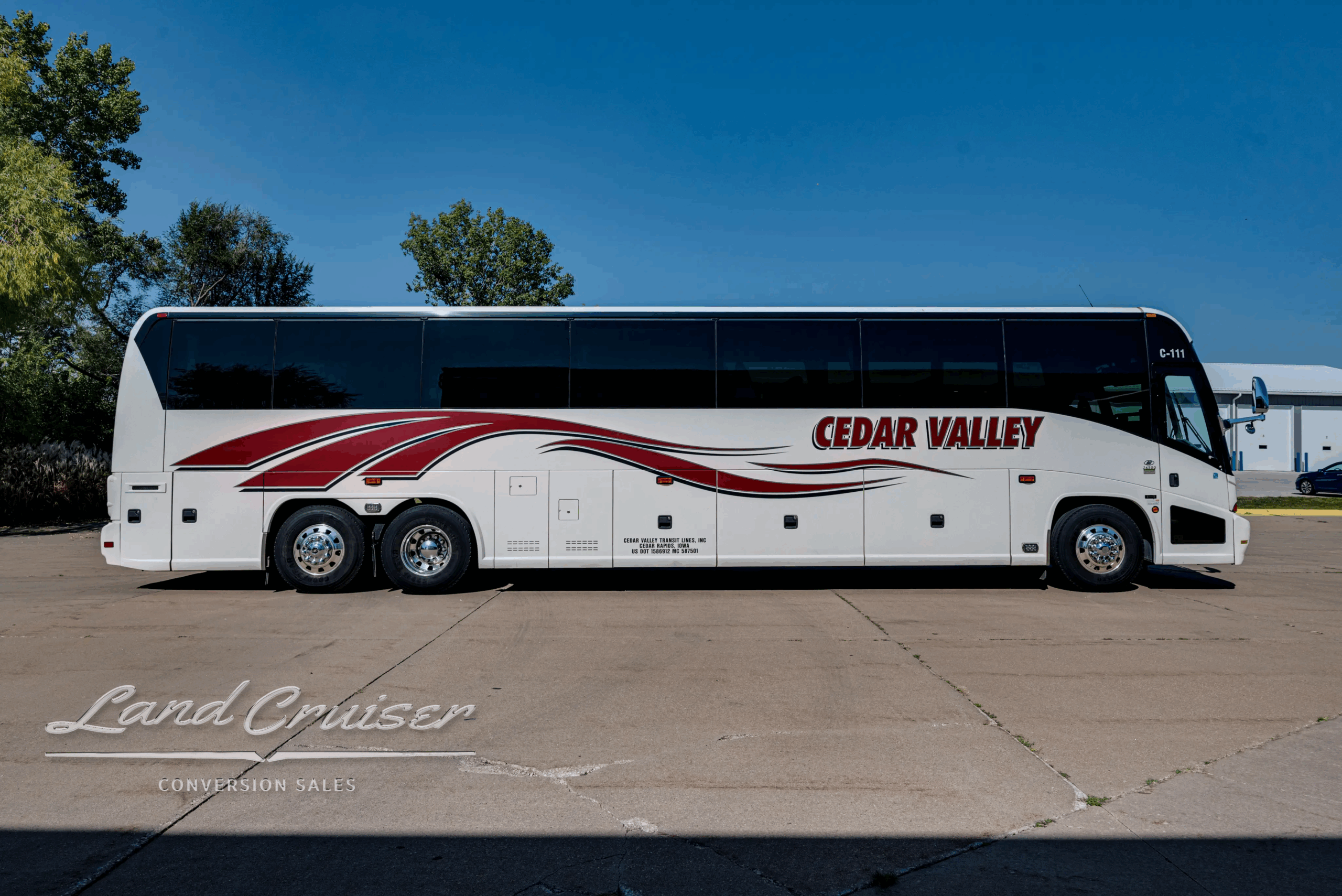 Passenger-side full profile with luggage bays closed.
