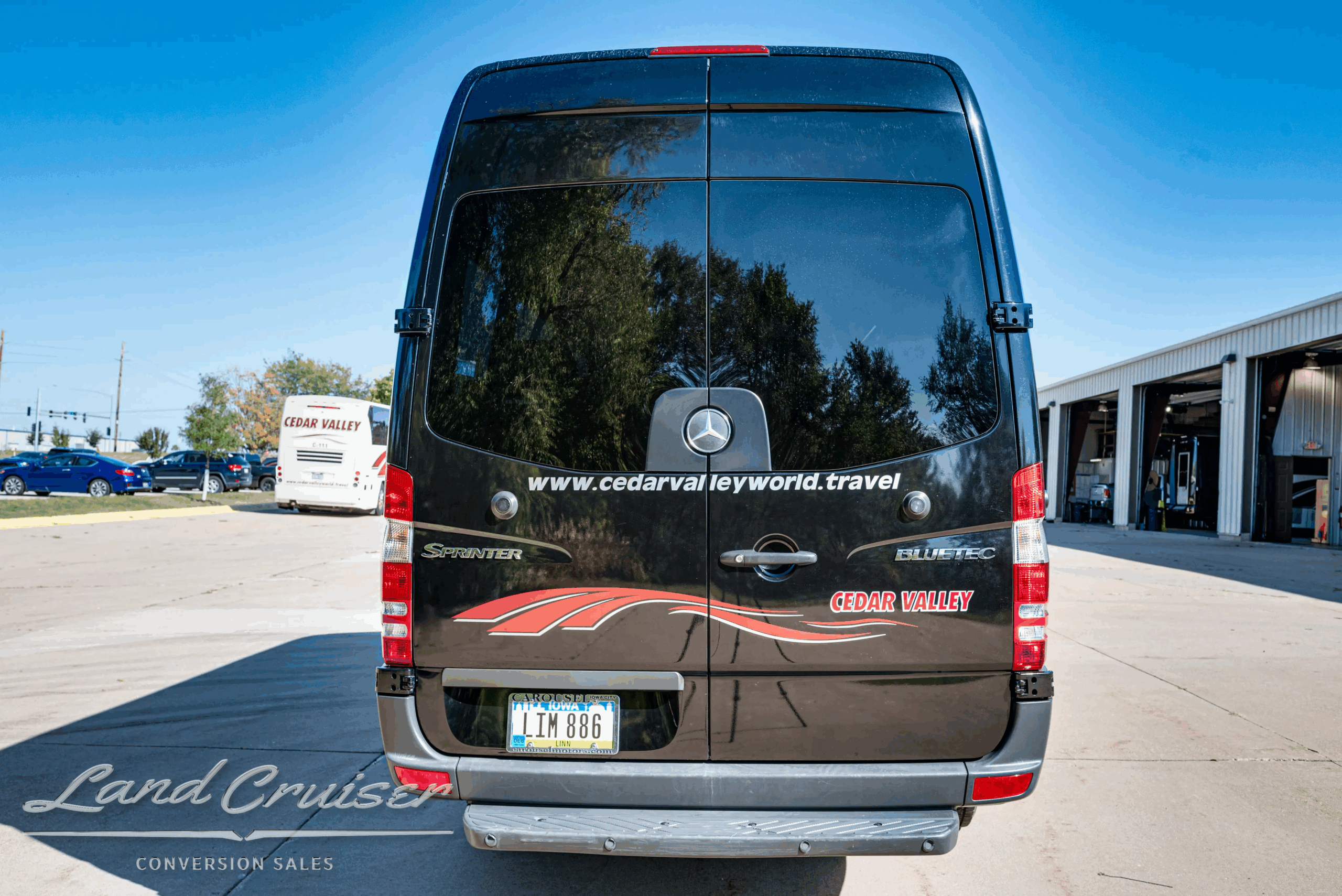 Rear view of Sprinter 2500 with privacy glass and conversion graphics.
