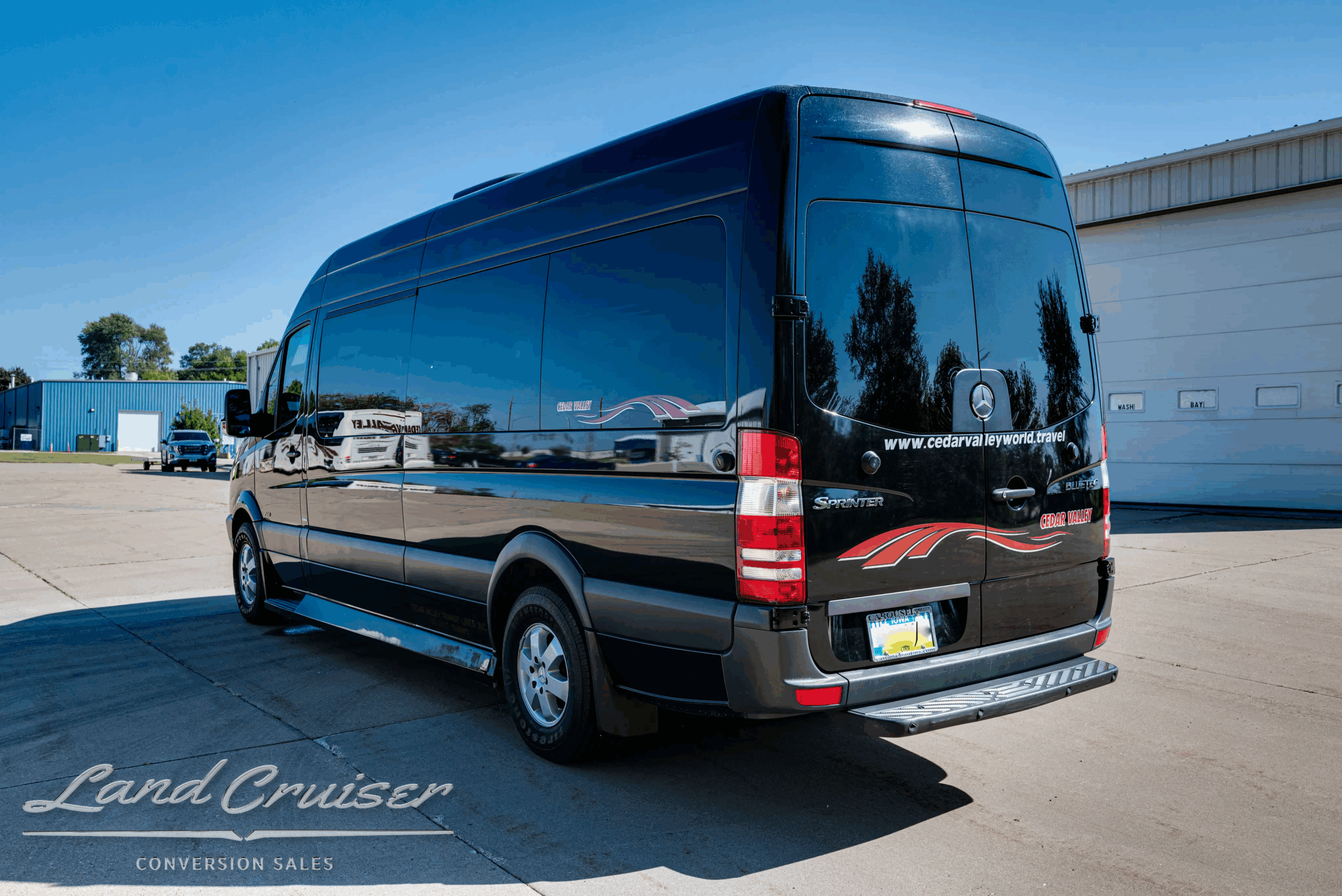 Rear view of Sprinter 2500 with privacy glass and conversion graphics.