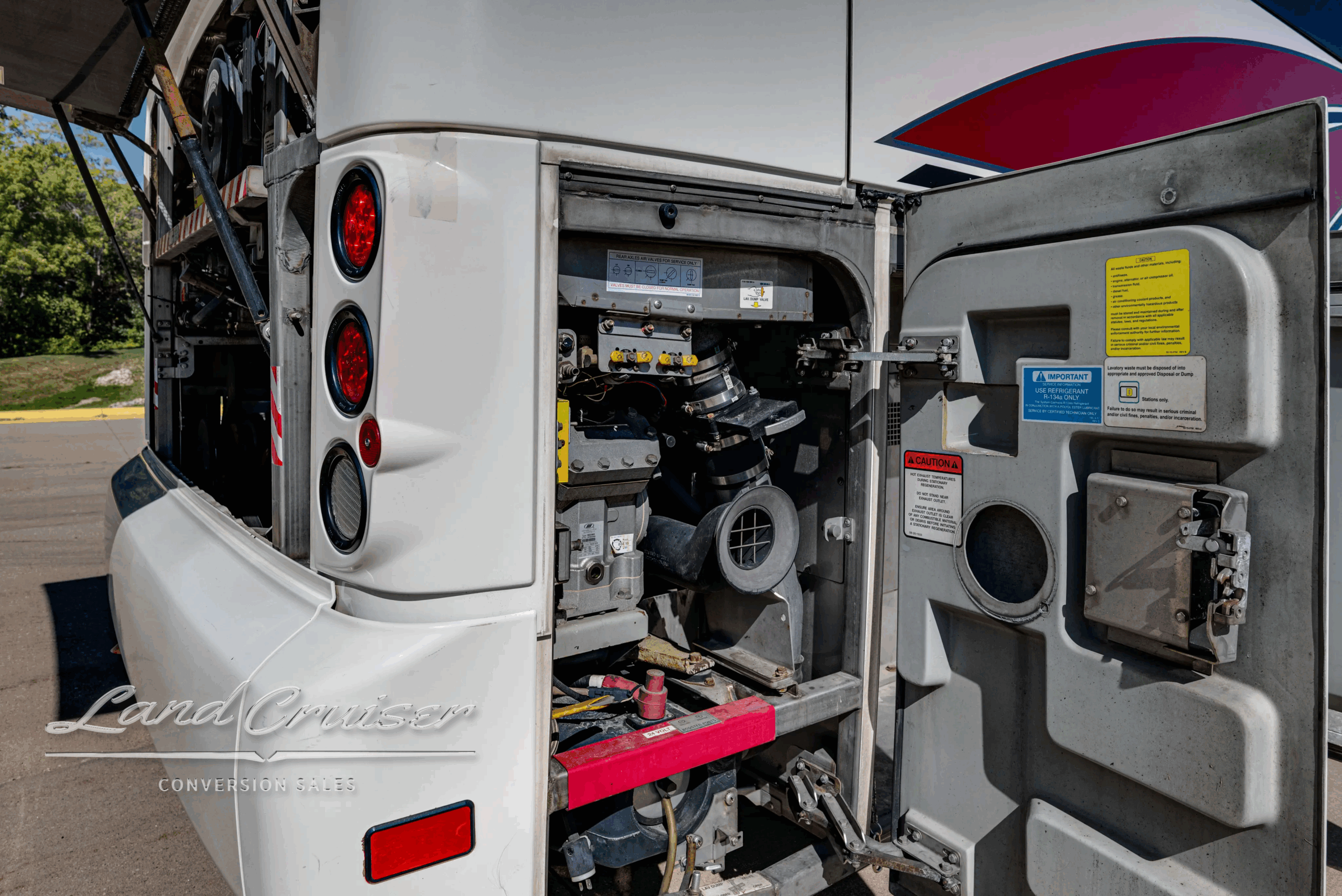 Service bay open showing storage and electrical components on the J4500.