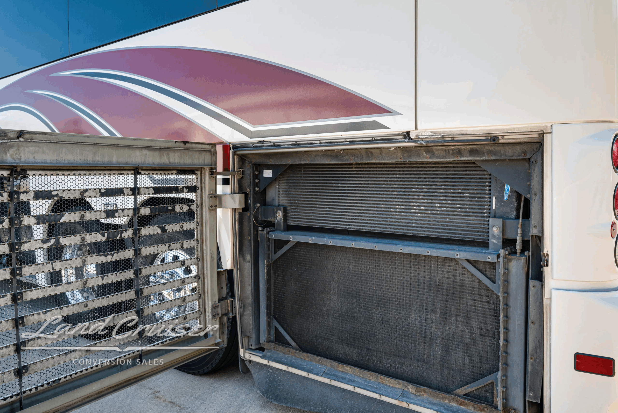 Radiator and charge-air cooler assembly behind side grille.