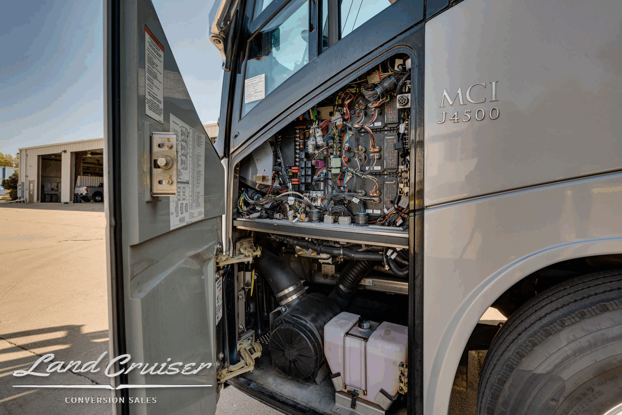 Electrical and fluid service panel near engine compartment.