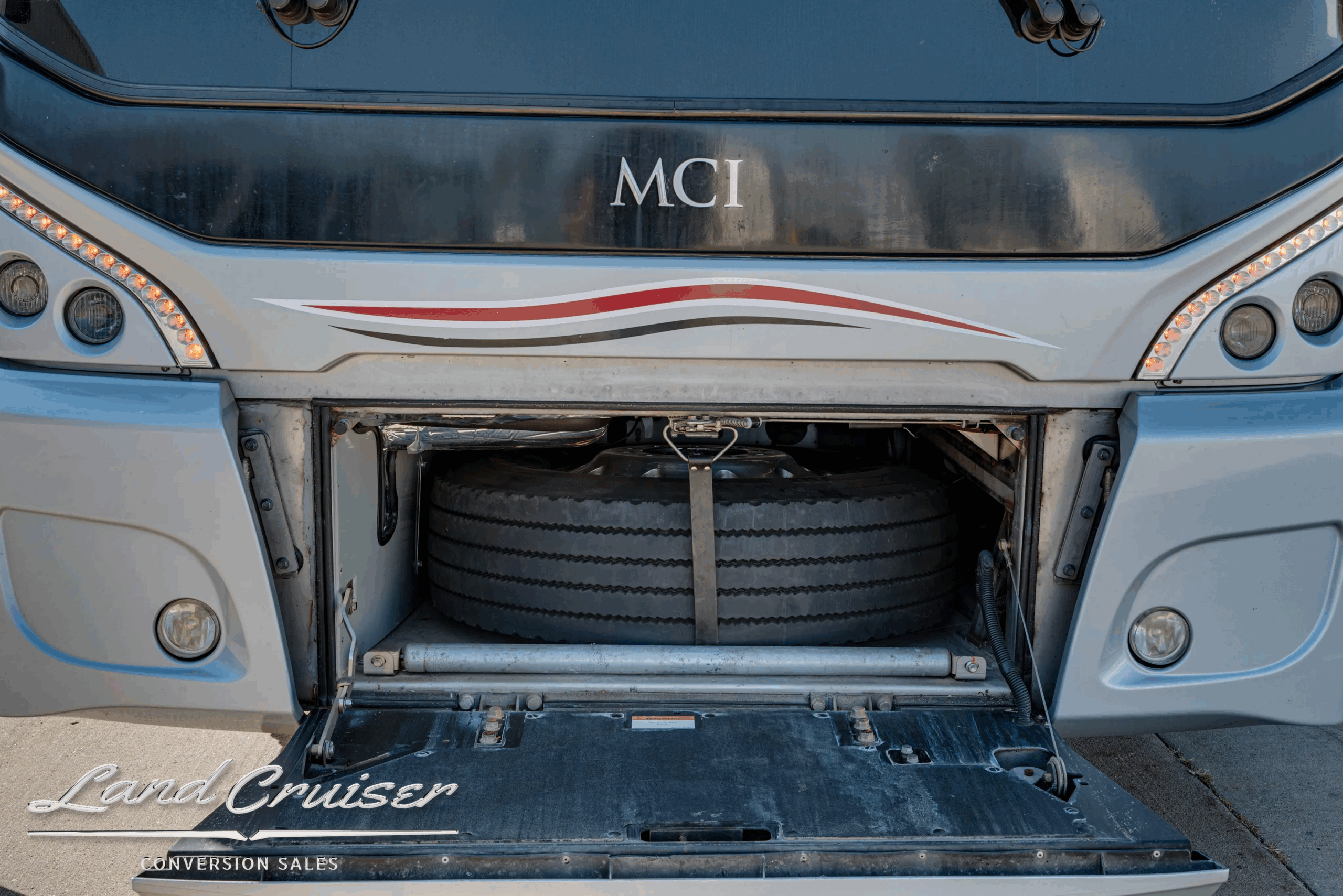 Front HVAC intake and grille behind access door.