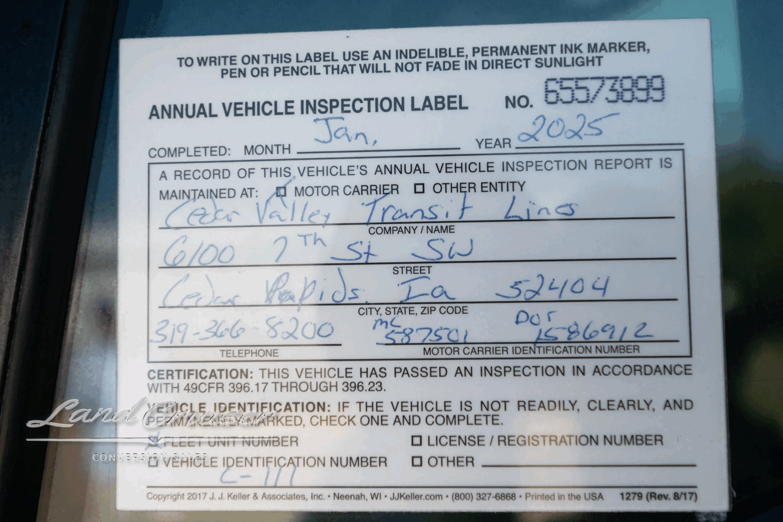 Annual vehicle inspection label with inspection date and operator information for the 2009 MCI J4500.