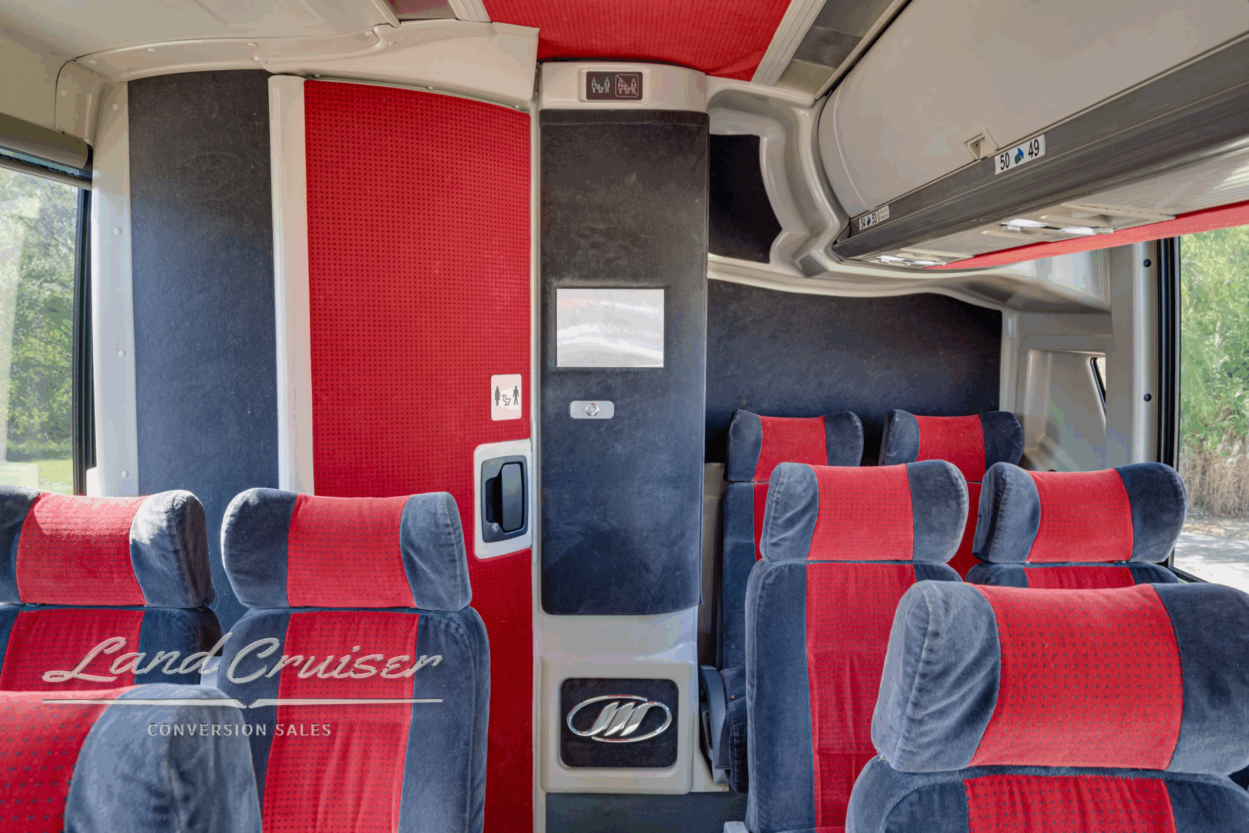 Rear seating area with cupholders and side panels.