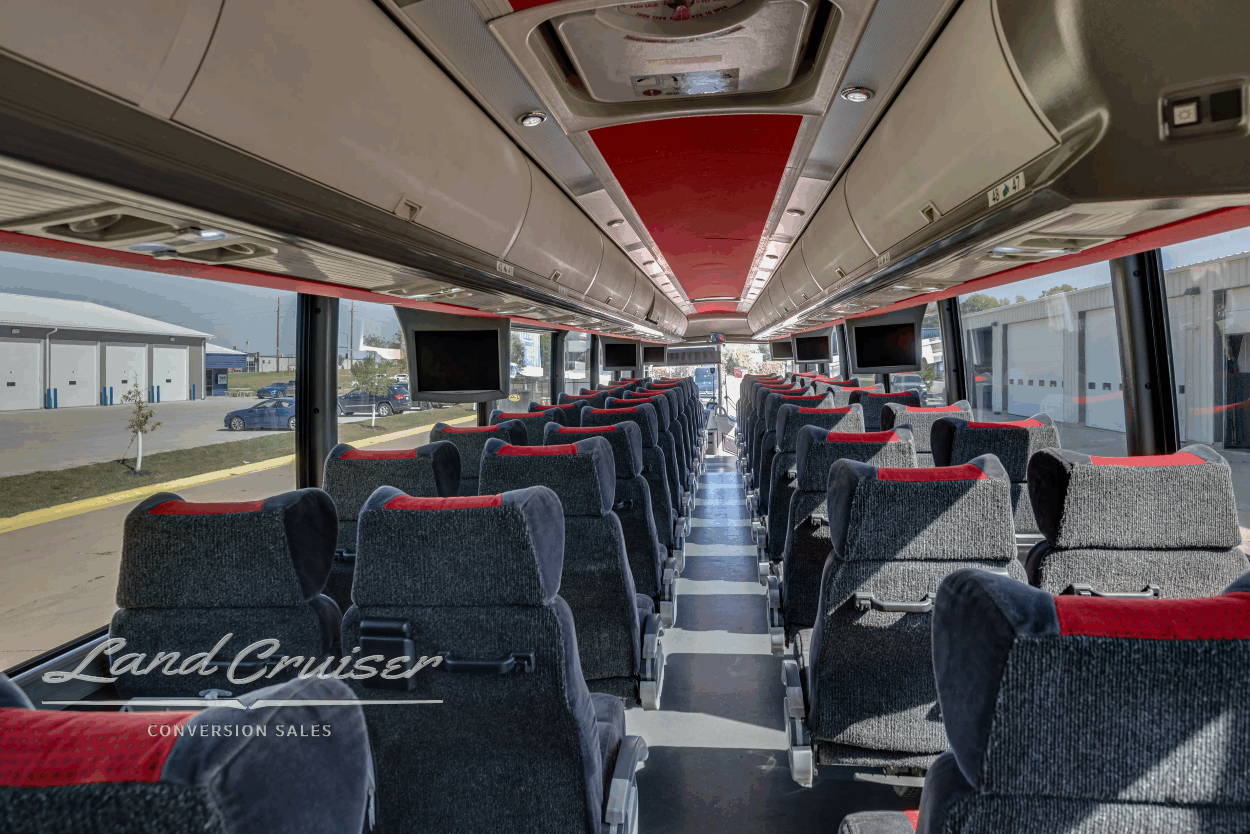 Seat row detail with headrests and fabric pattern.