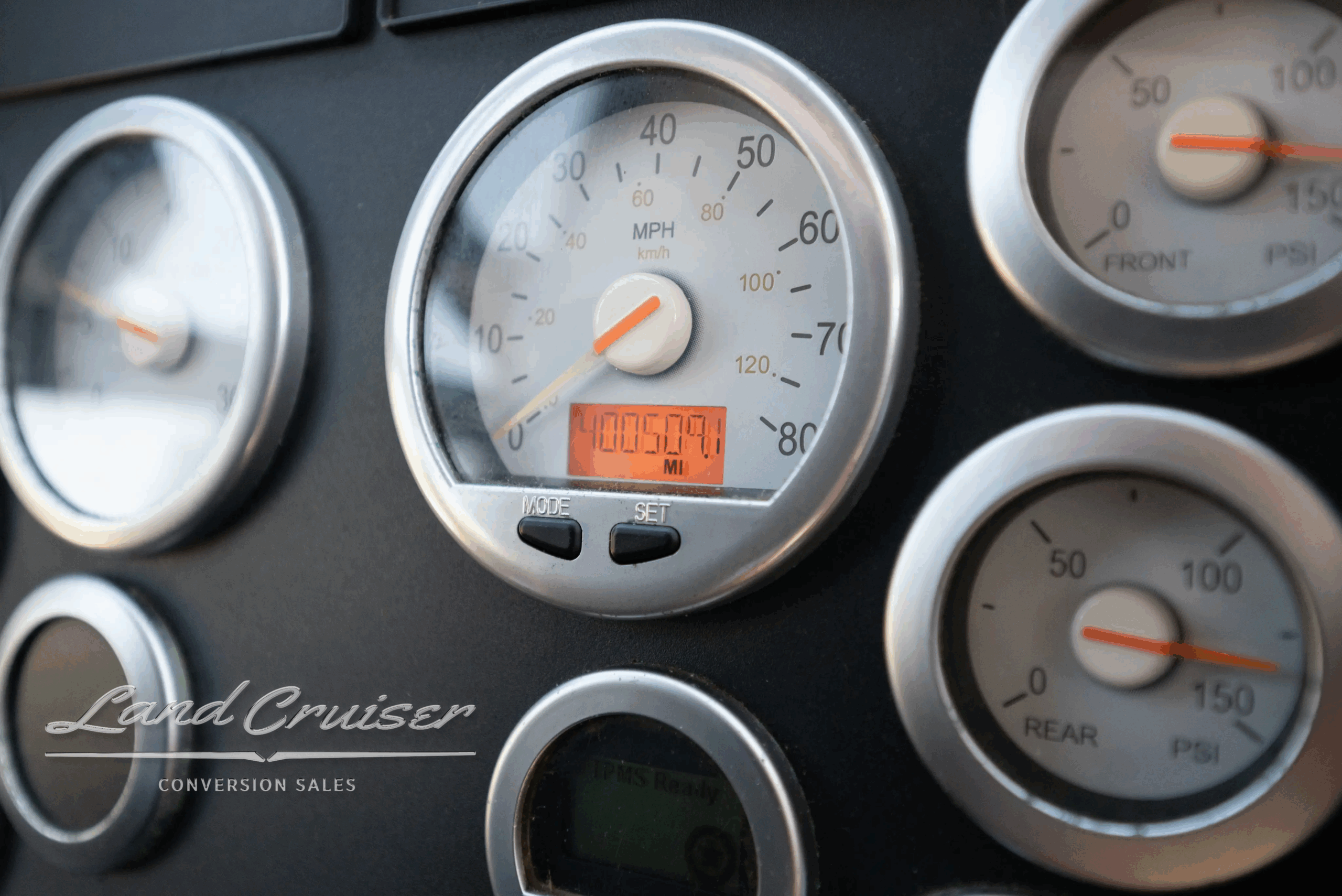 Instrument cluster close-up showing speedometer and gauges.