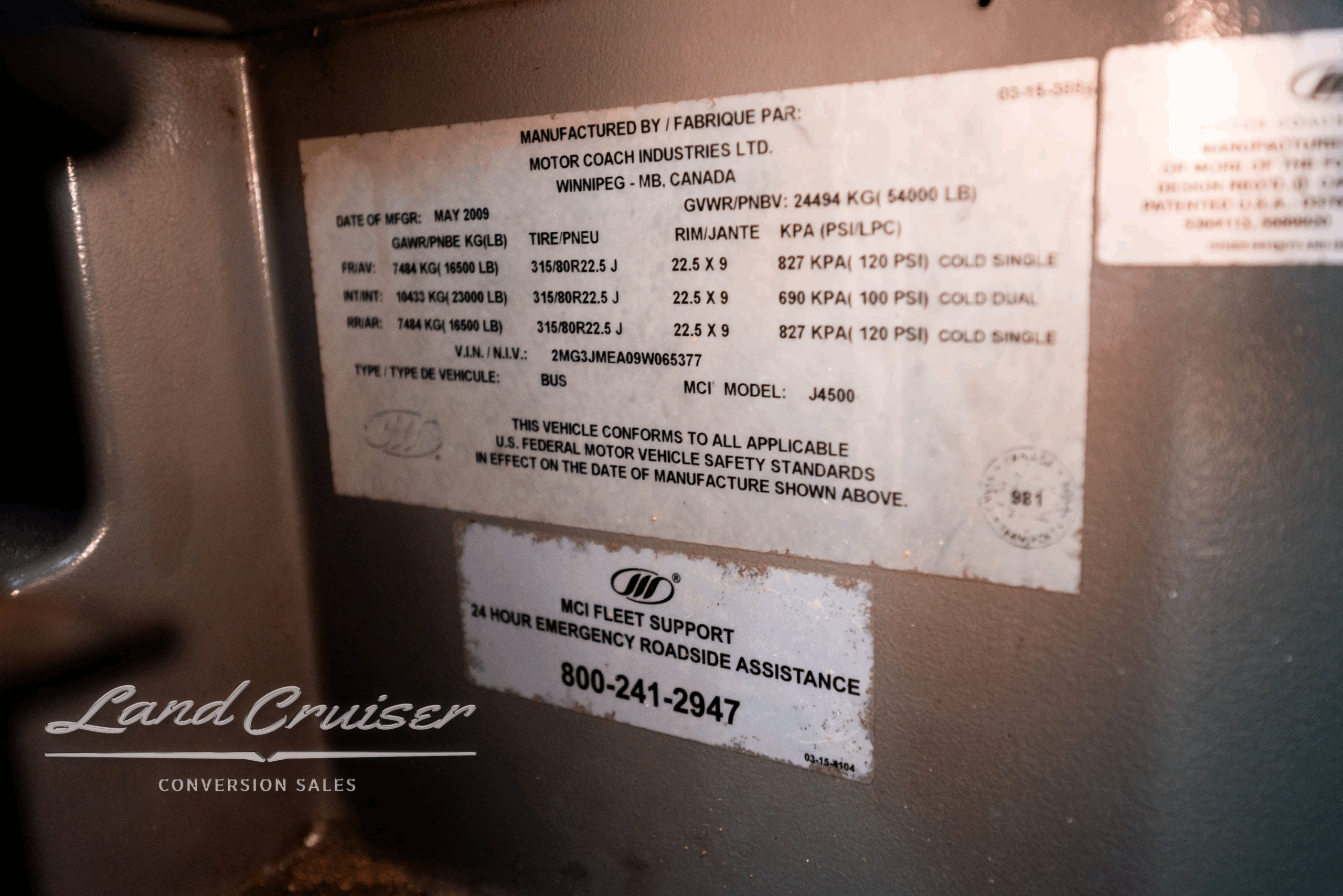 Manufacturer/VIN data plate and specifications label inside the MCI J4500 coach.