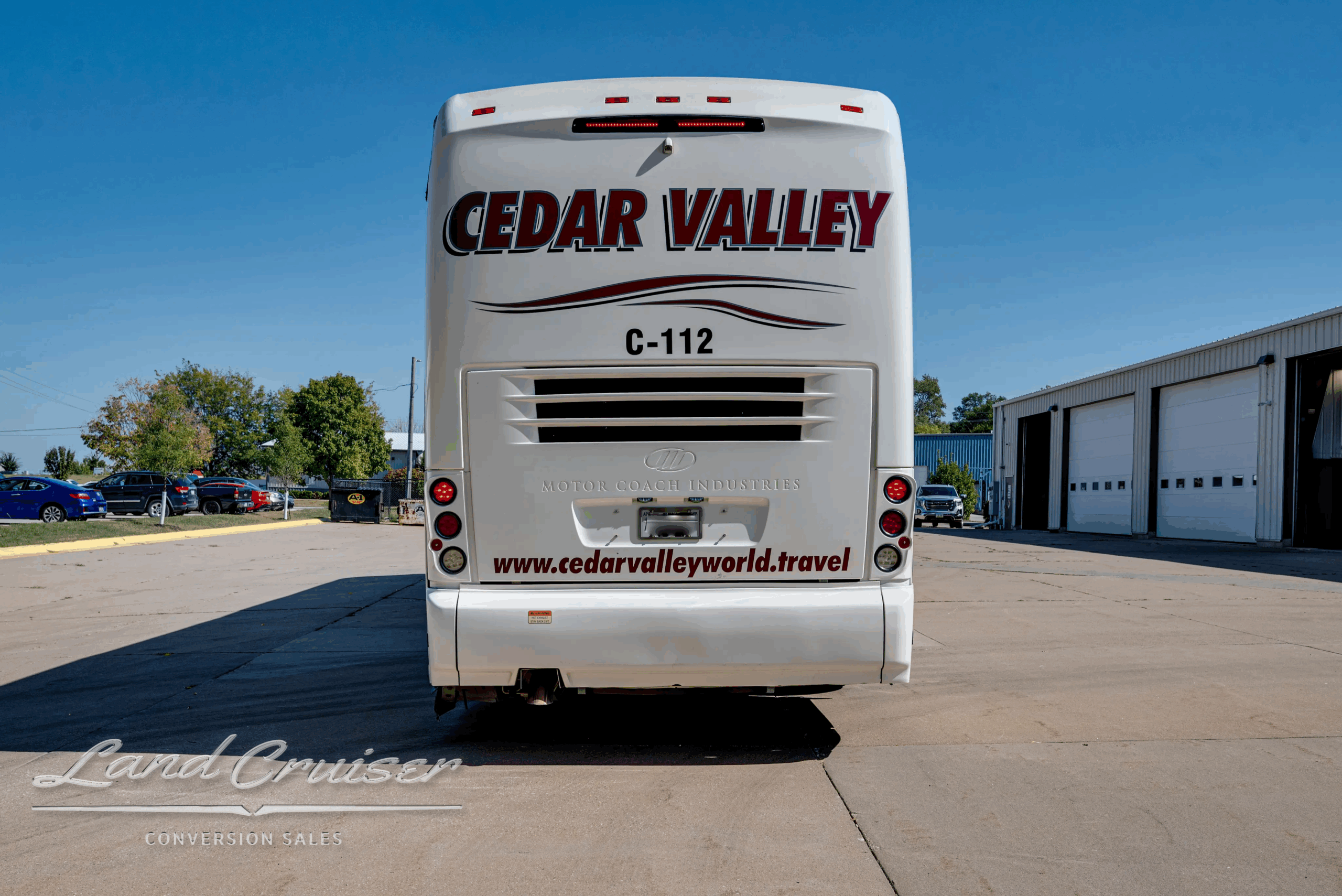Straight rear view with C112 badging on the motorcoach.
