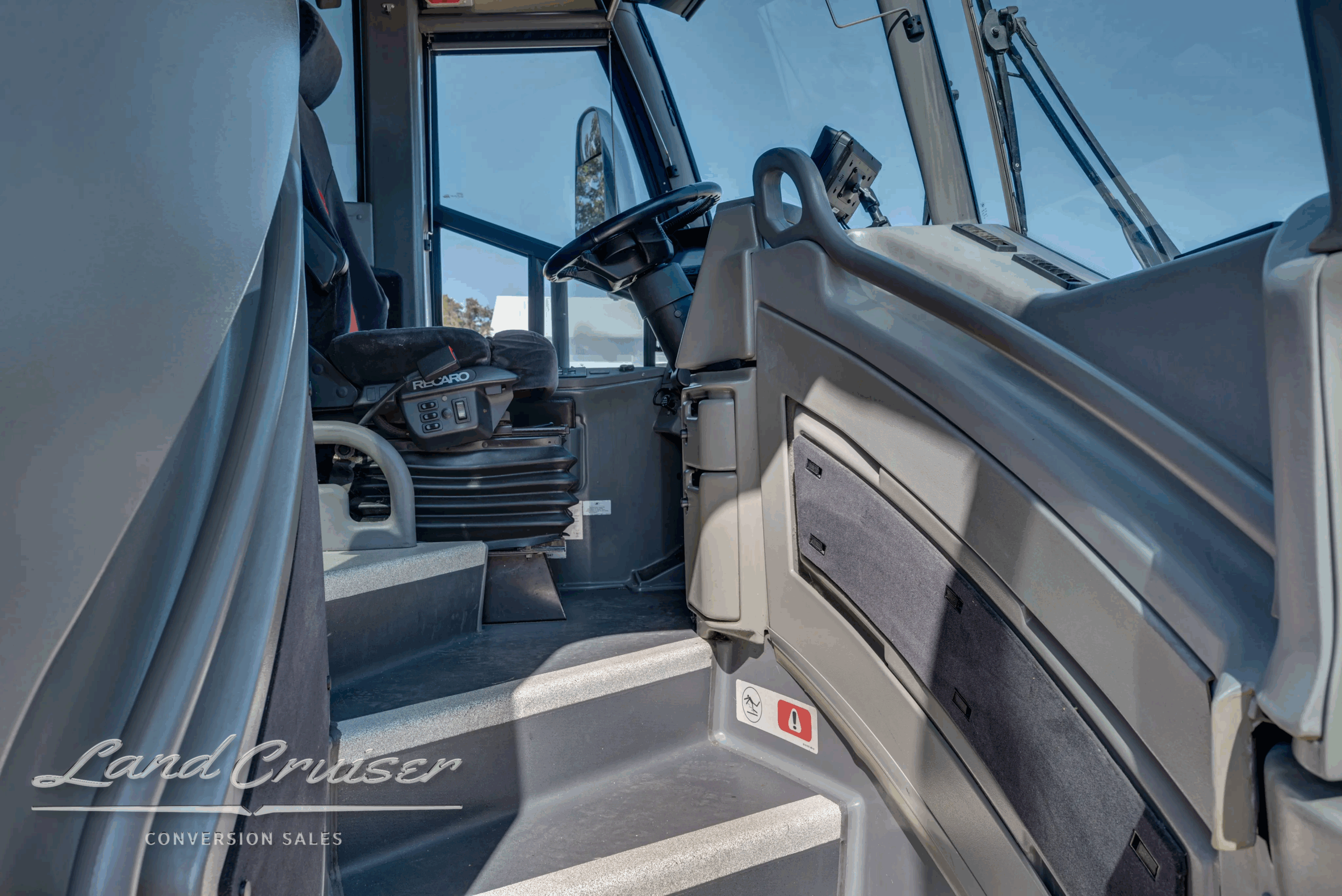Entry stairwell and handrails leading to the cabin and driver area.