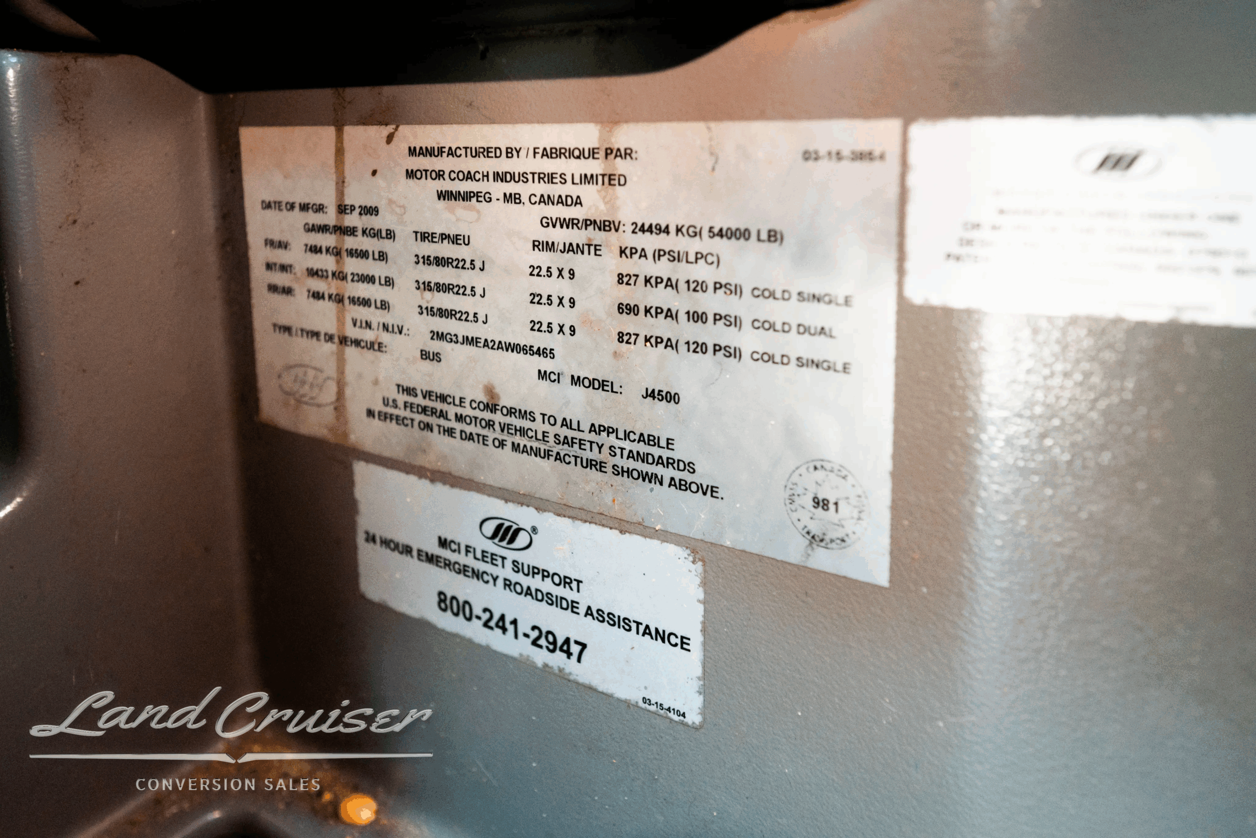 Manufacturer/VIN data plate and specifications label inside the coach.