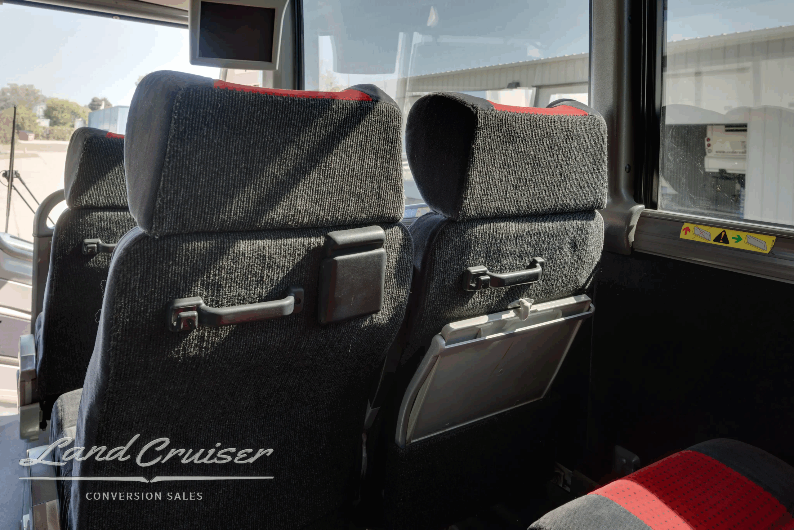 Passenger seat and armrest detail inside the 2010 MCI J4500.