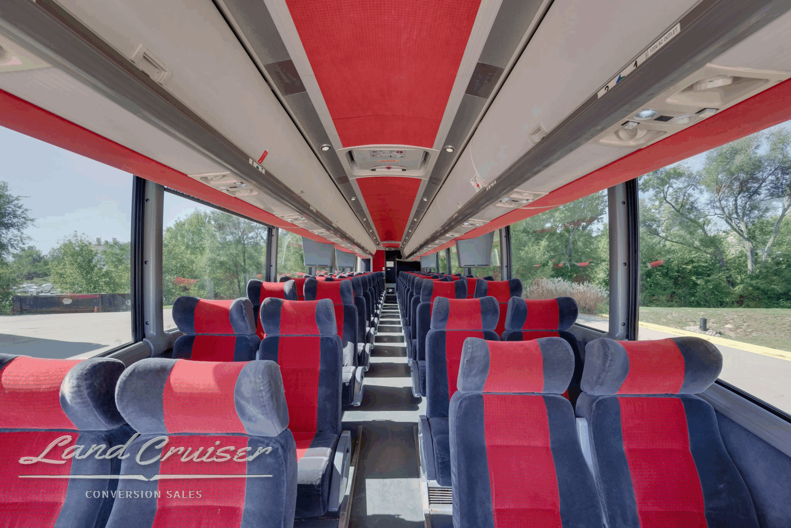 Center aisle looking forward—56-passenger seating with overhead racks.