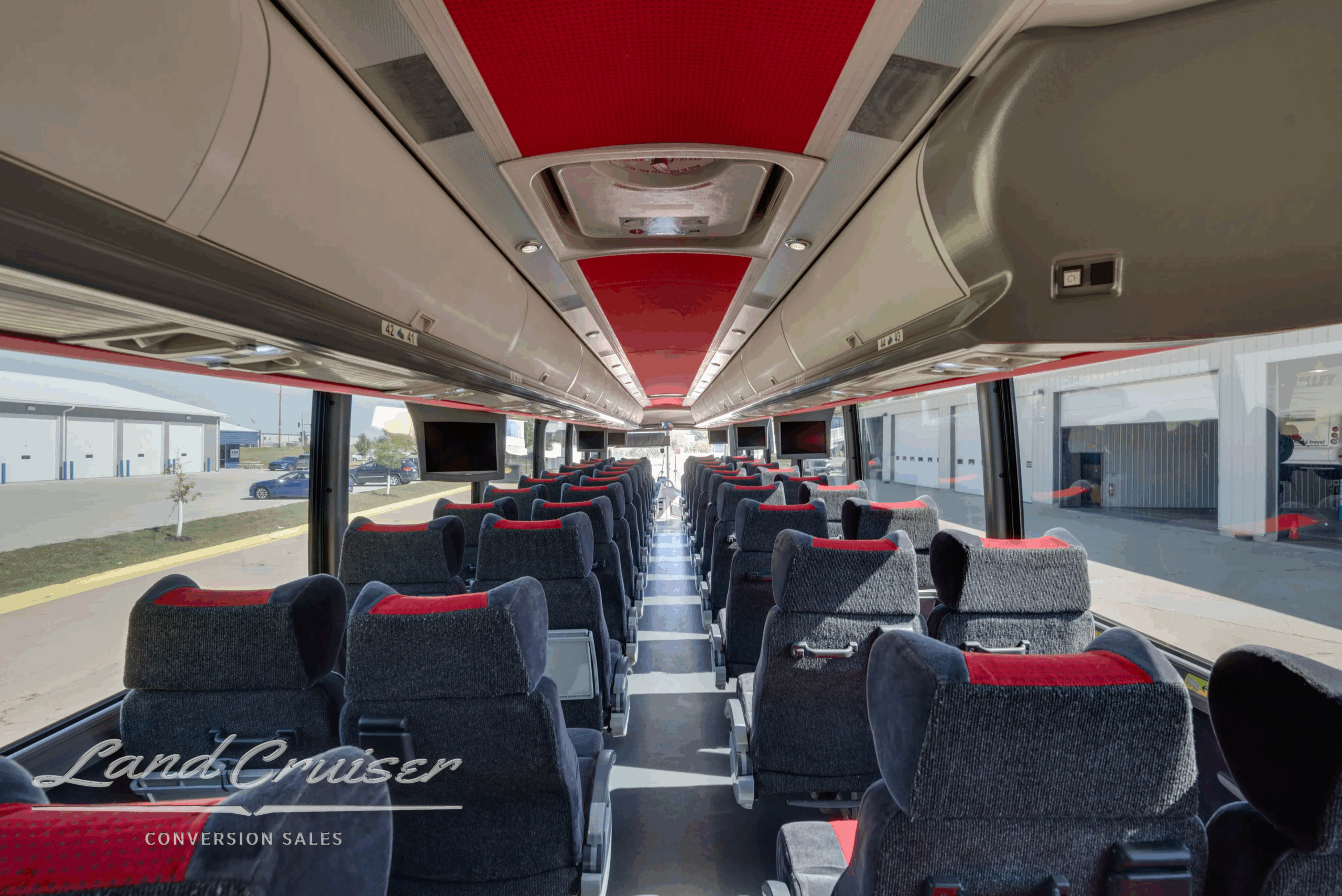Long aisle perspective looking aft through the passenger cabin.