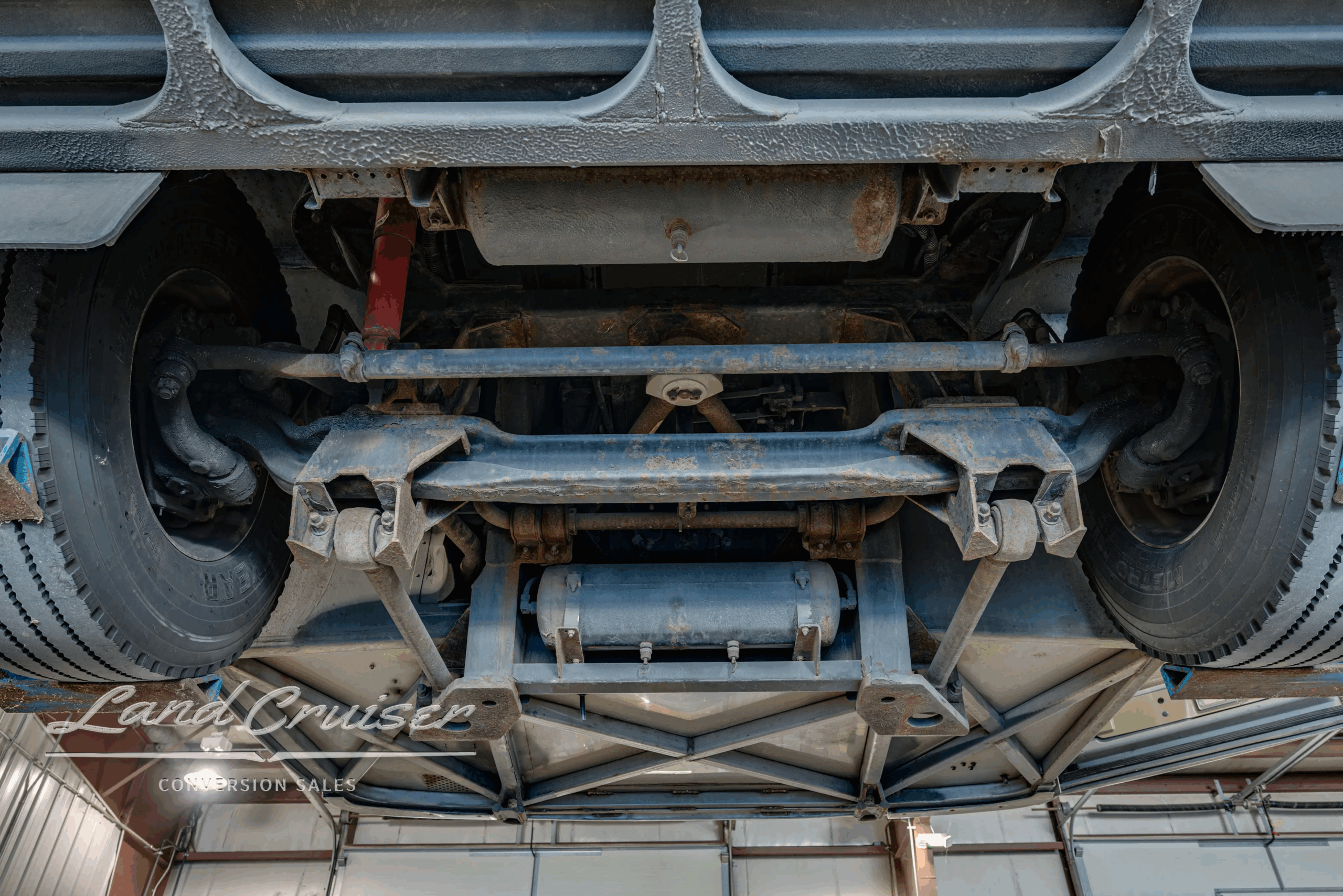 Chassis underbody showing brake and suspension hardware.