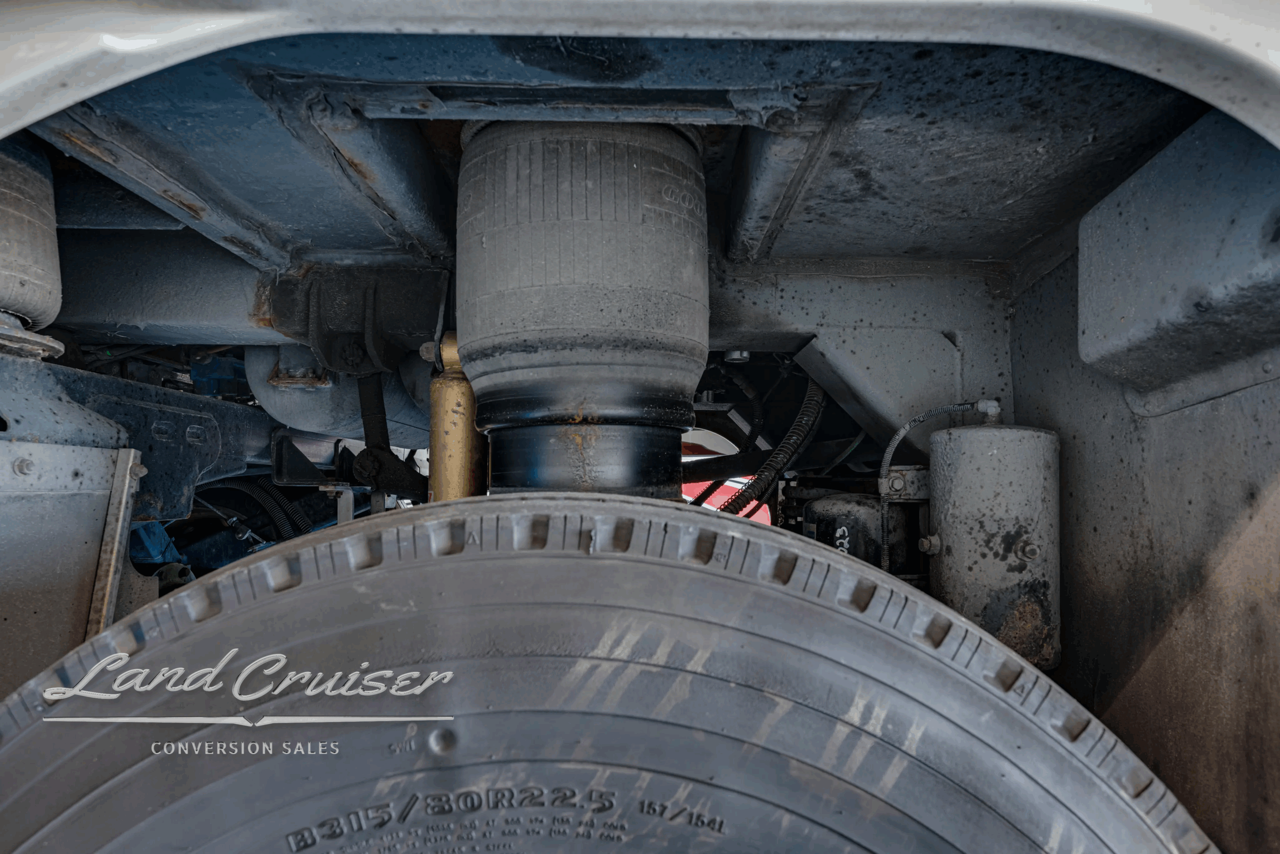 Forward undercarriage section with steering/sway components.