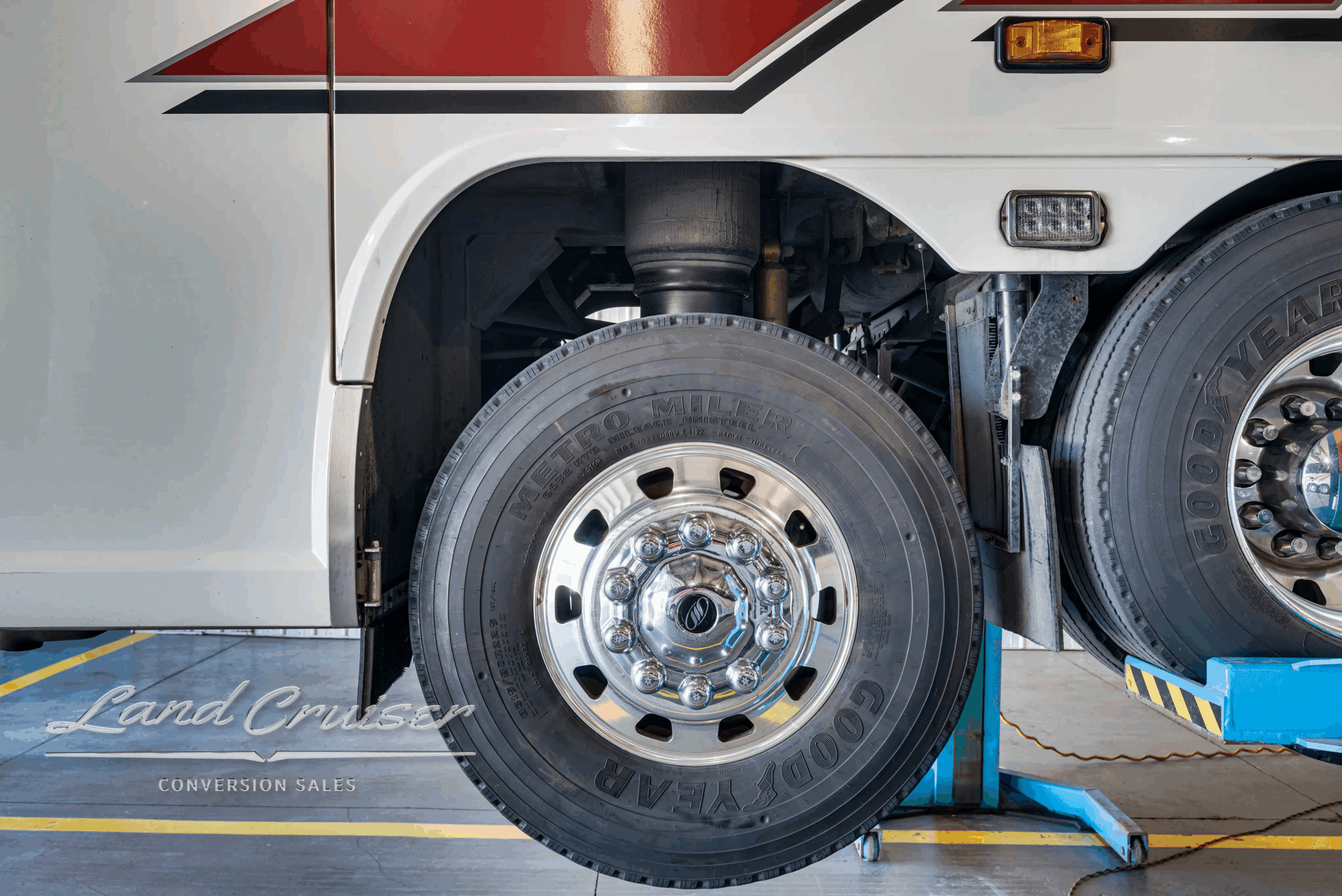Drive-axle wheel and tire close-up.