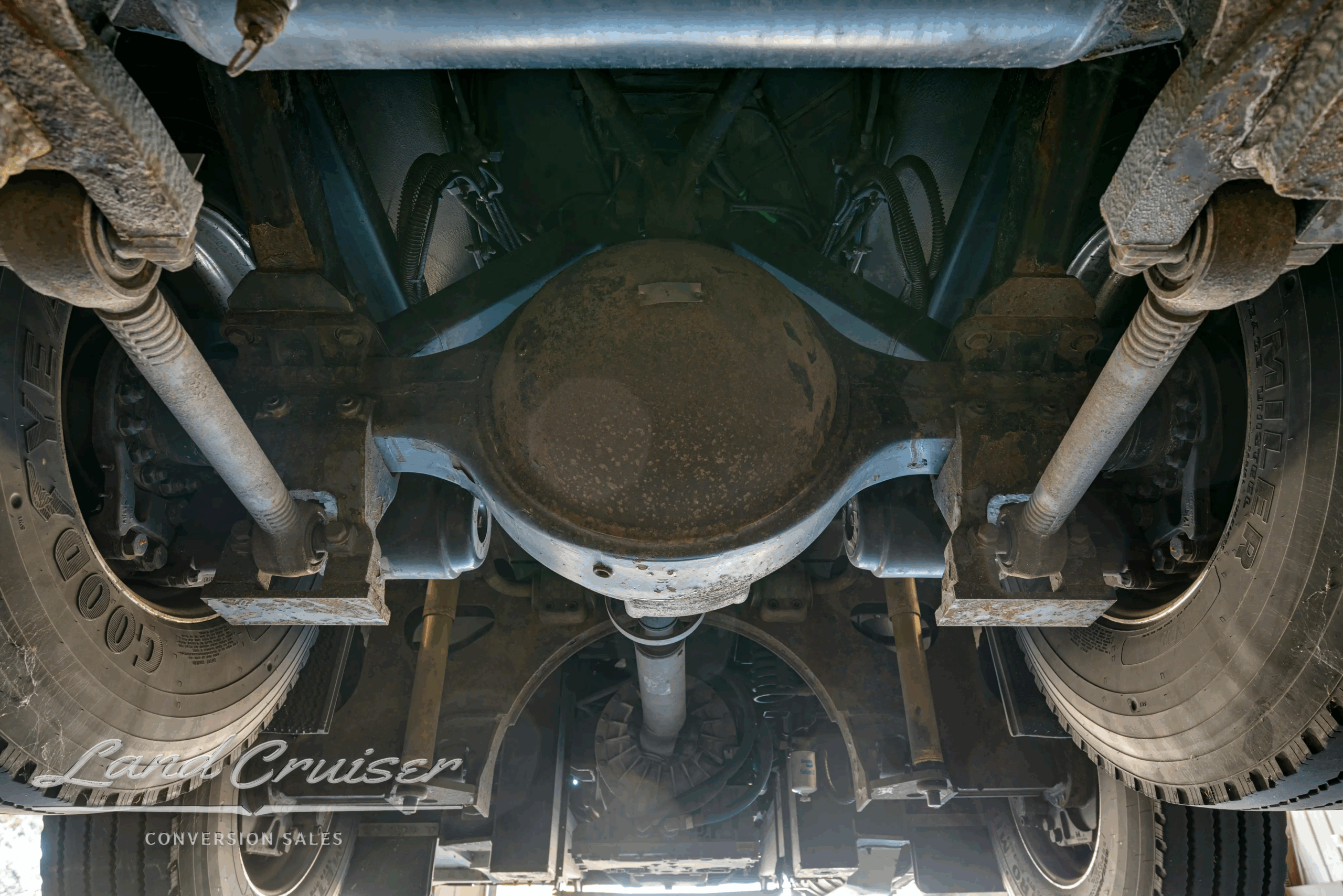 Rear drive-axle differential and suspension arms.