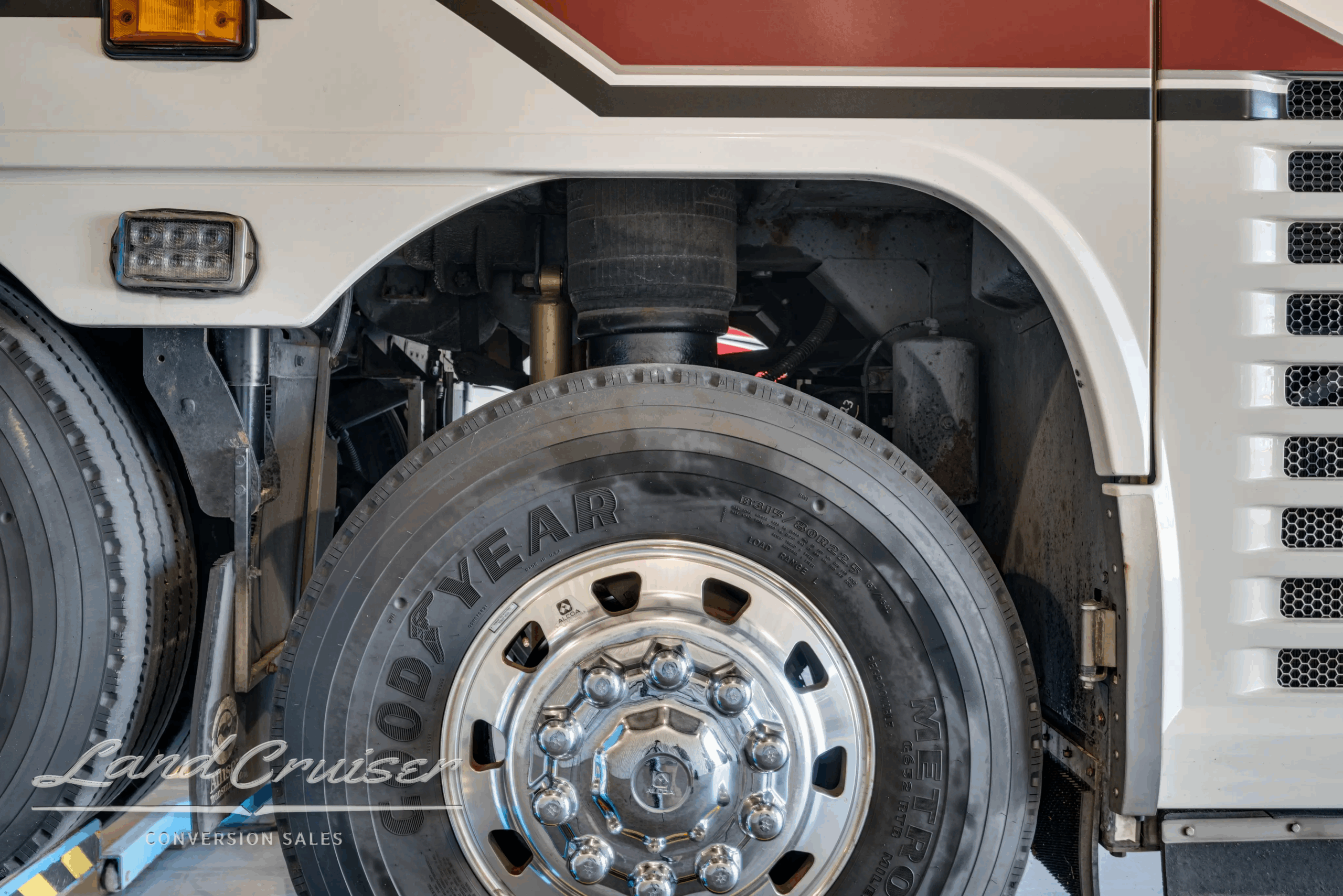 Drive-axle wheel and tire close-up.