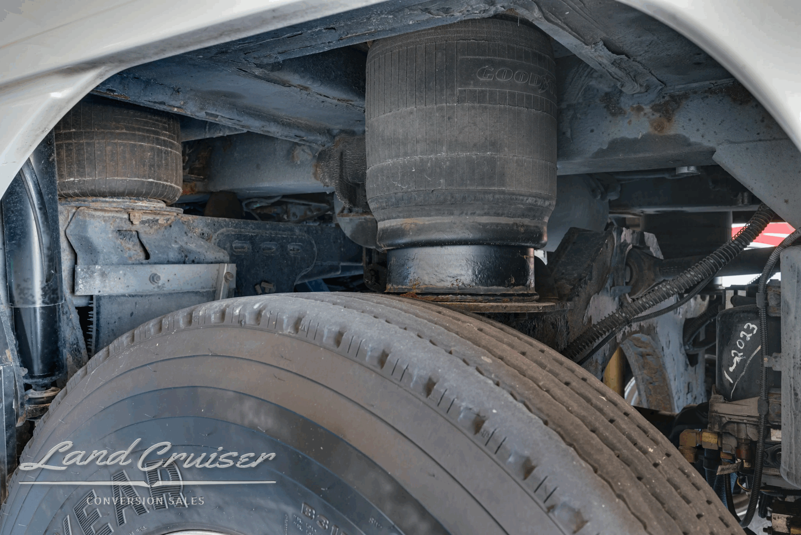 Rear wheel arch with air bag and suspension hardware.