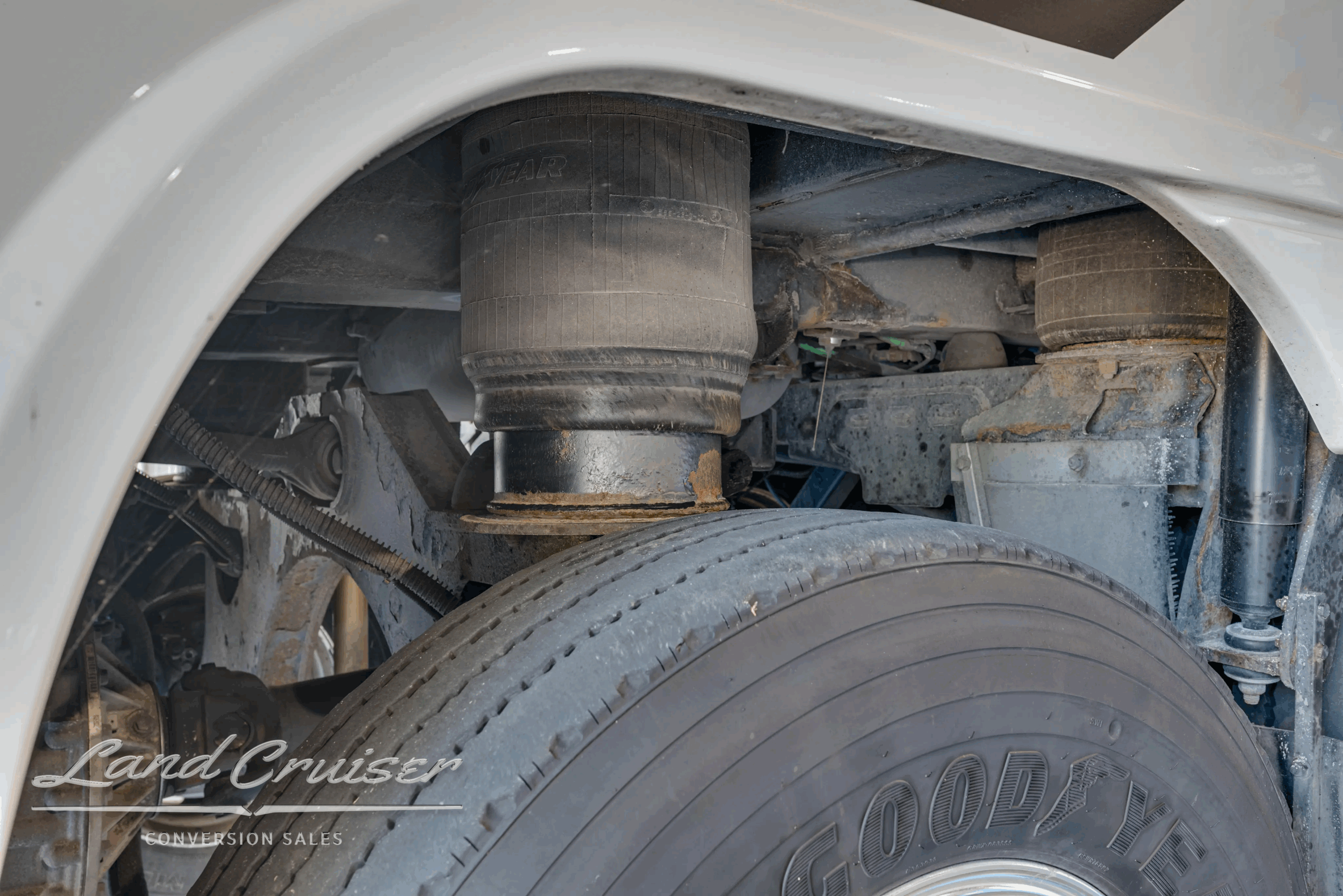 Drive-axle wheel and tire close-up.