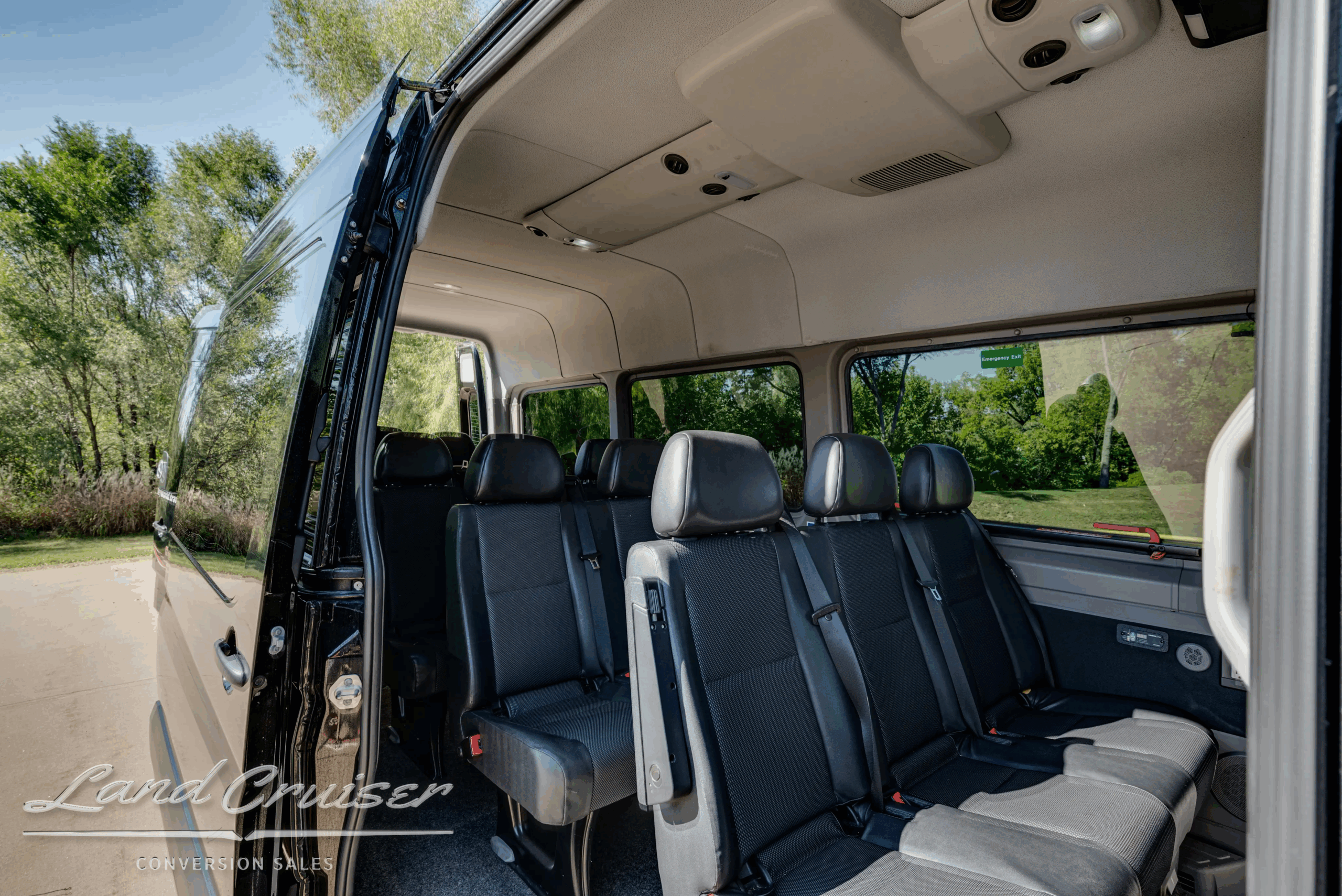 Interior mid-cabin view showing leatherette bench seating and overhead vents.