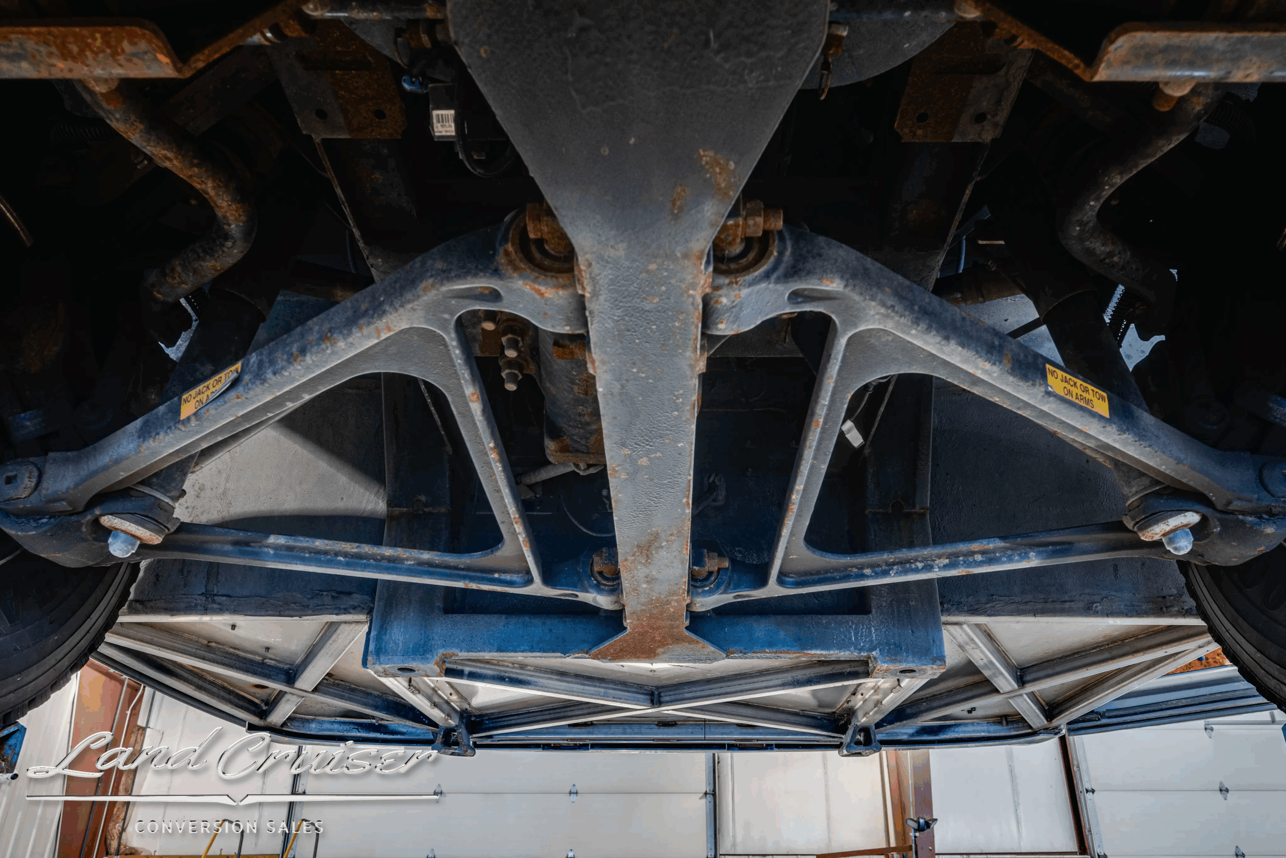 Chassis underbody with V-braces and mounts.