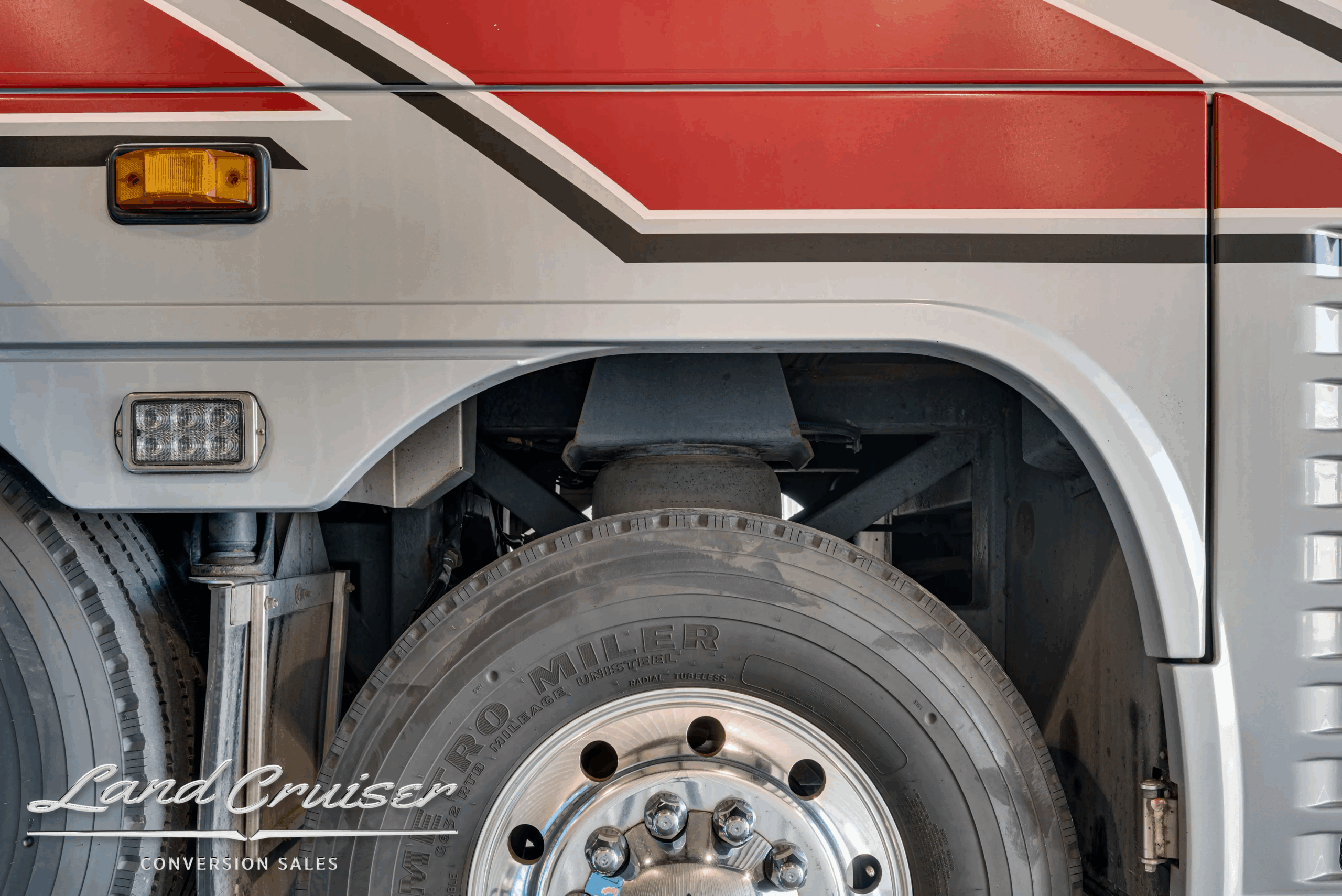 Steer-axle wheel and tire close-up.