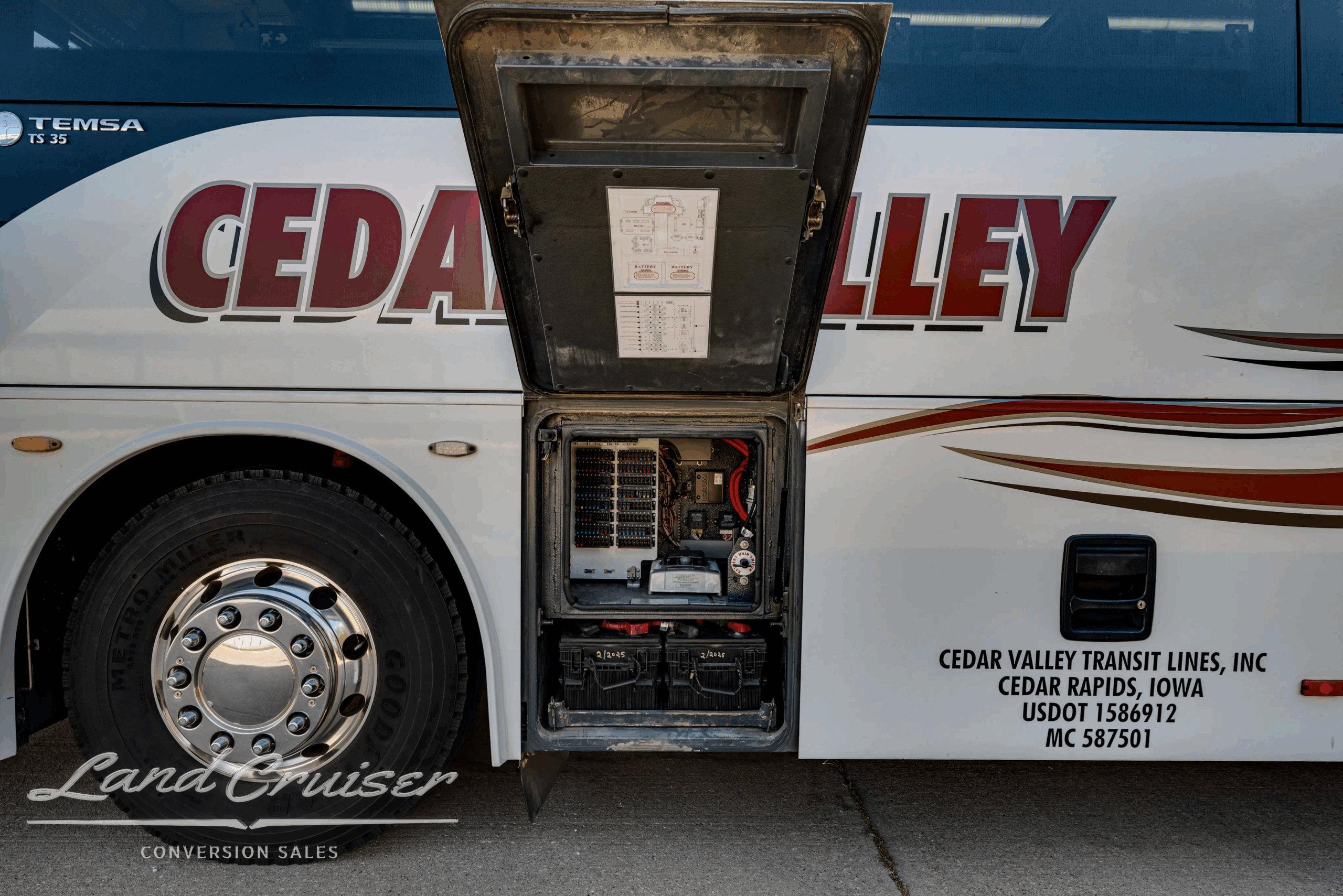 Side service door open showing fluid/electrical components.