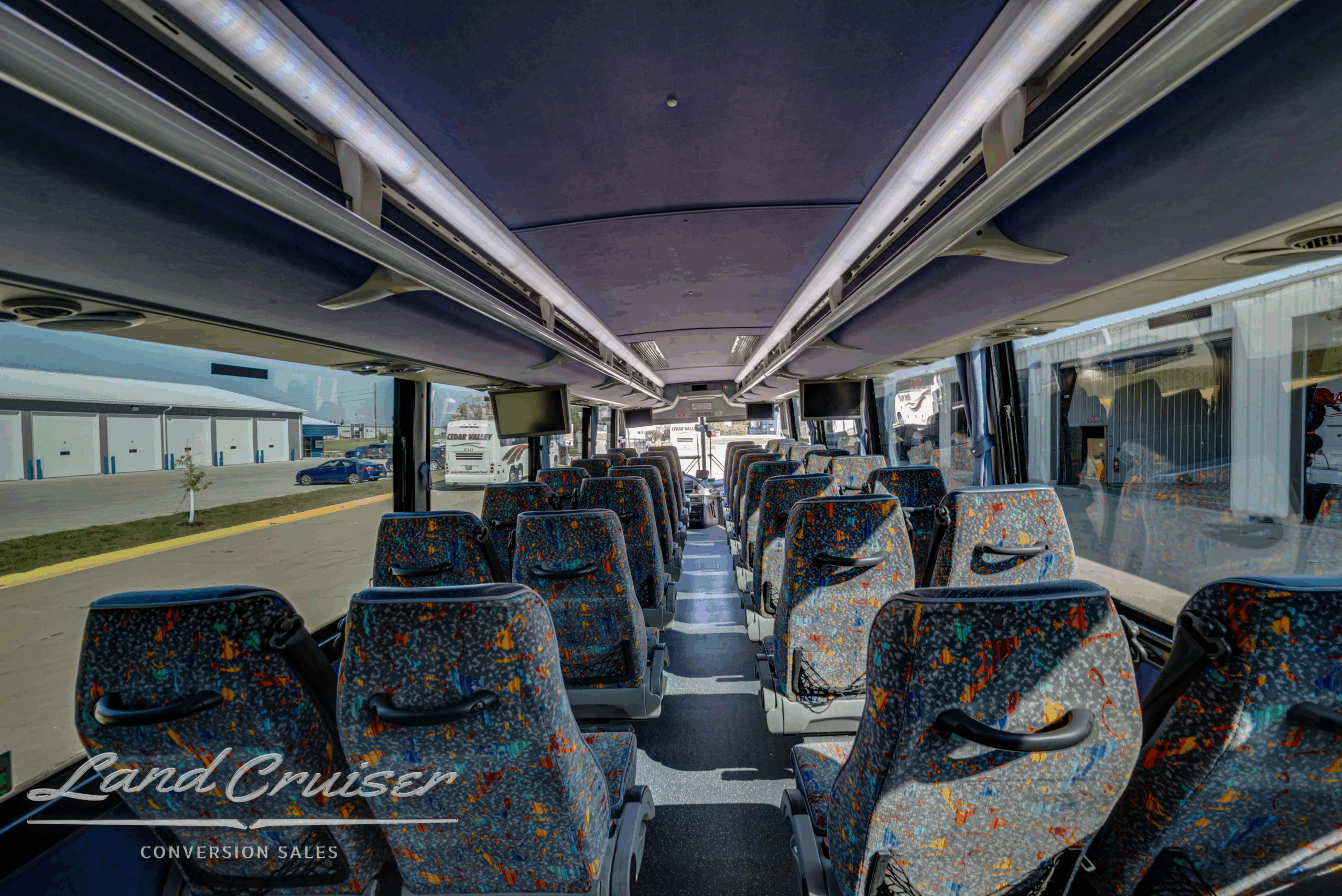 Long aisle view toward the front with 40-passenger seating.