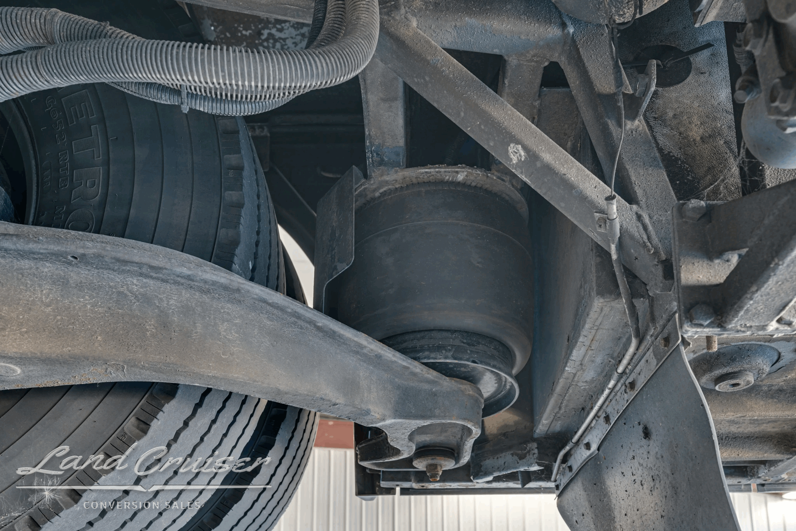 Suspension torque arm and wheel housing detail.