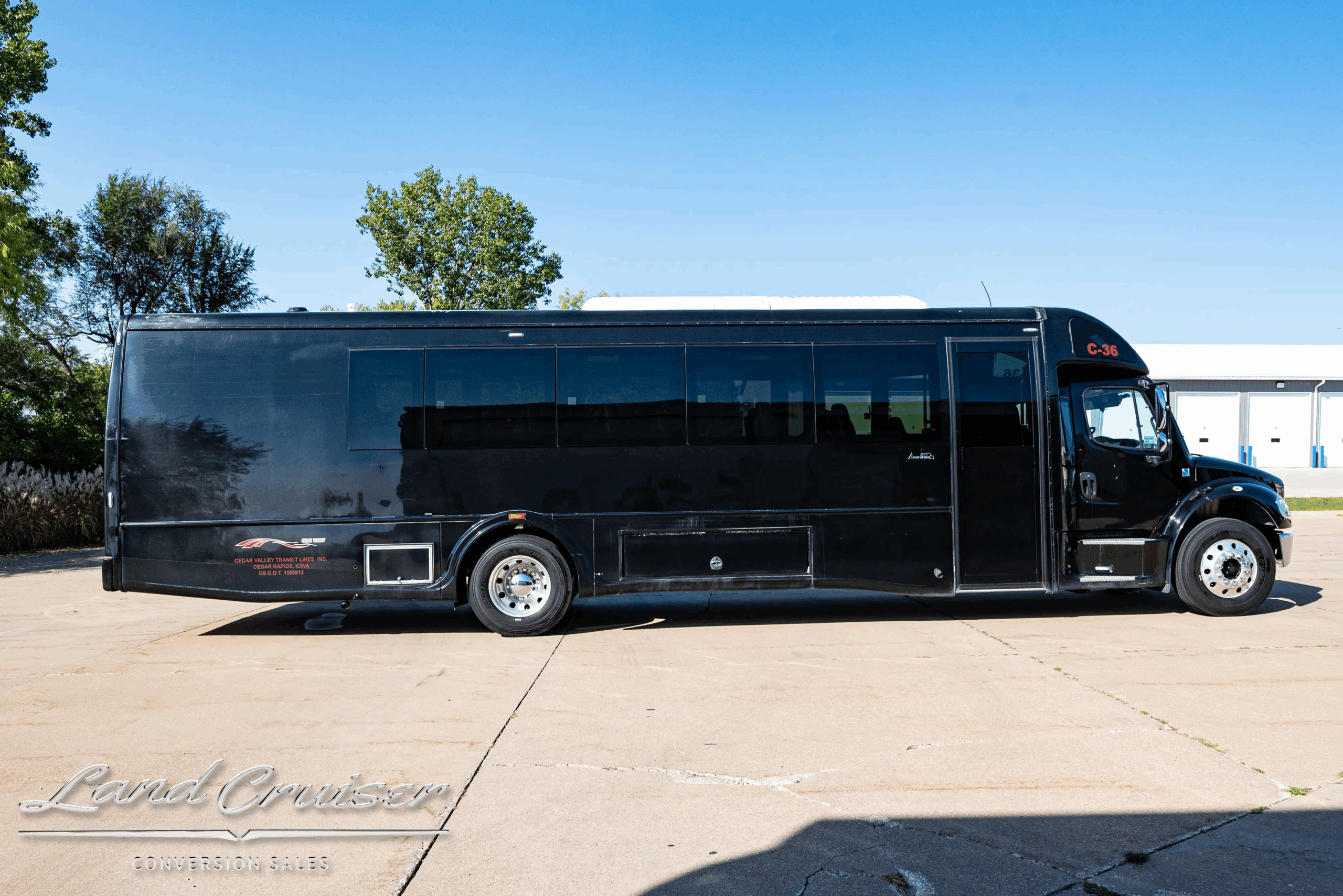 Passenger-side profile showing long, 102-inch-wide coach.