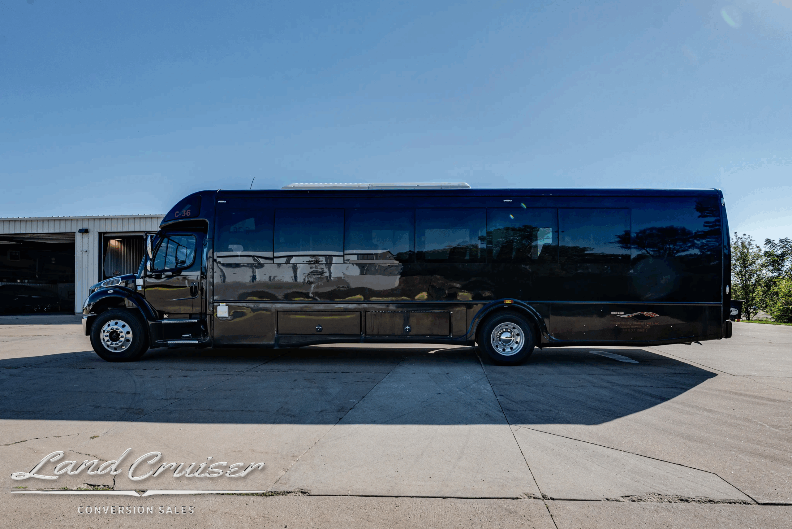 Driver-side full profile of 40-ft Freightliner M2V395 passenger bus.