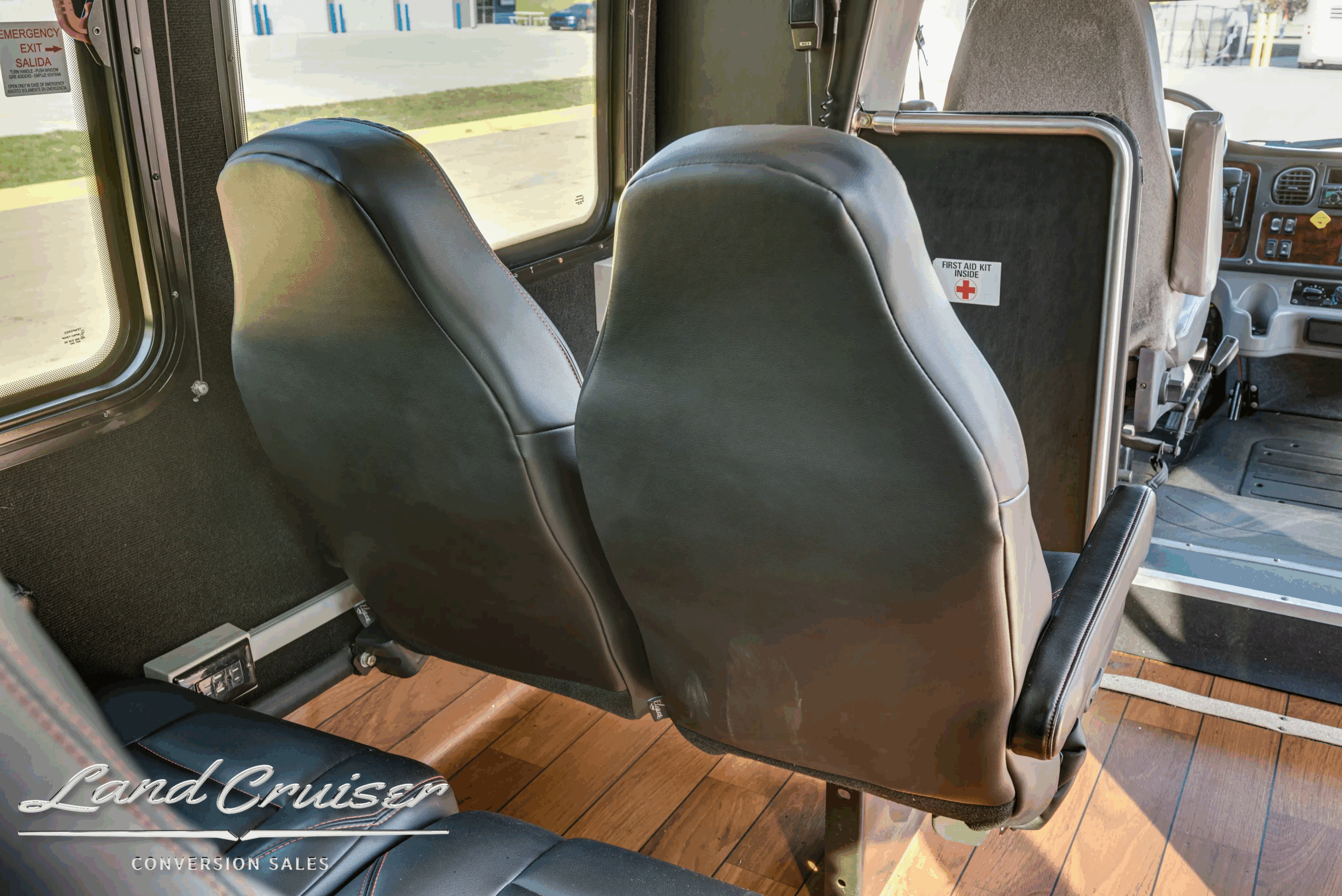 Close-up of padded passenger seats inside the Ameritrans shuttle.